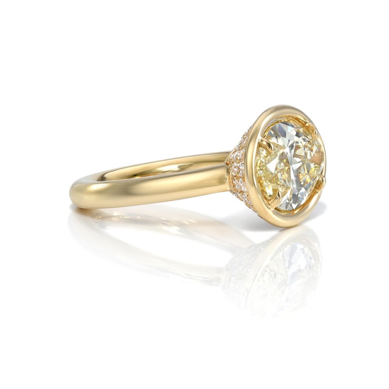 4.23ct S-T/SI2 GIA certified Marquise cut diamond with 0.95ctw Old European cut accent diamonds prong set in a handcrafted 18K yellow gold mounting. 