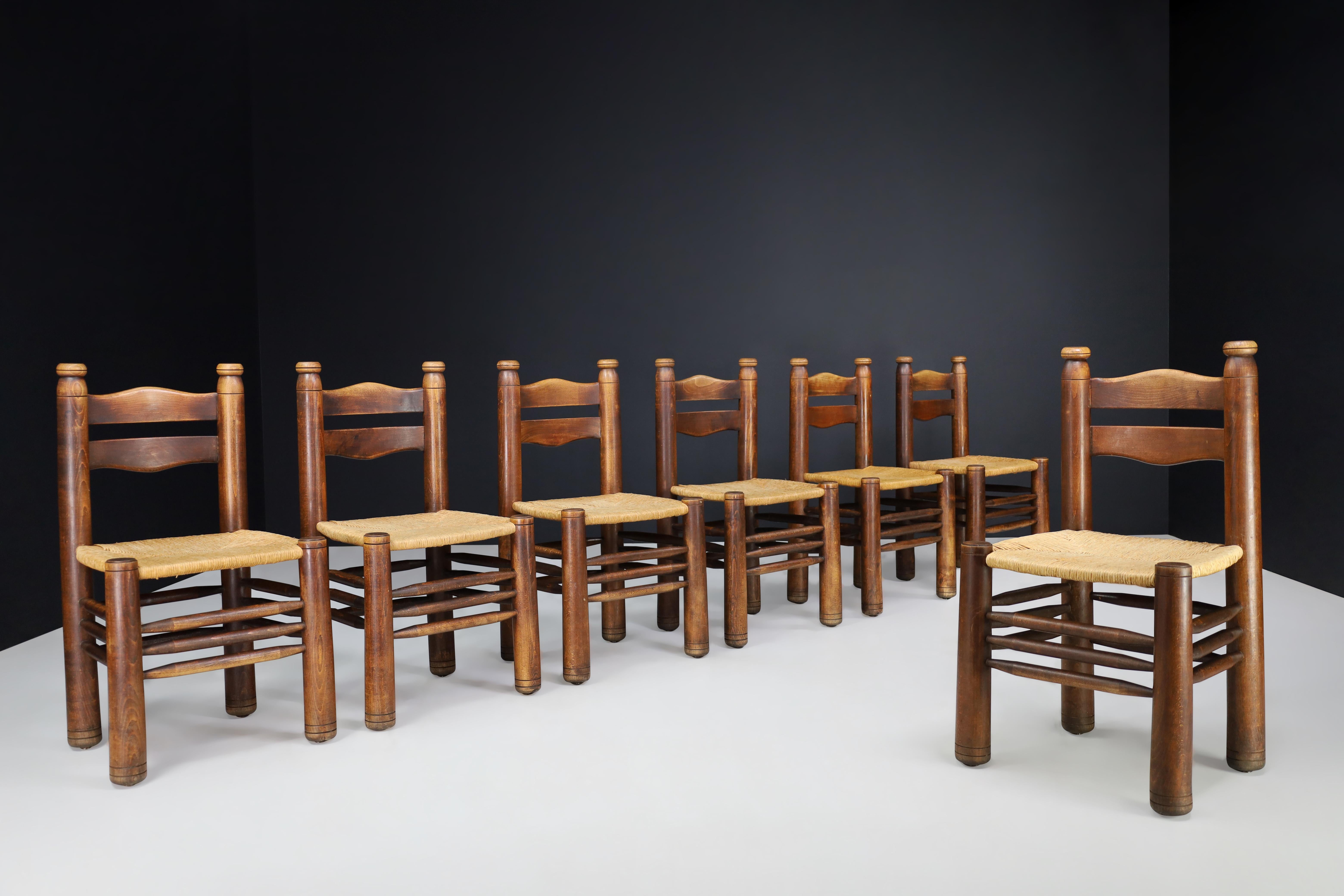 Handcrafted Dining room chairs in wood and rush, France, 1940s

These handcrafted dining room chairs are crafted from rustic wood and rush in the style of Charles Dudouyt, dating back to 1940s France. The chairs are in excellent condition,