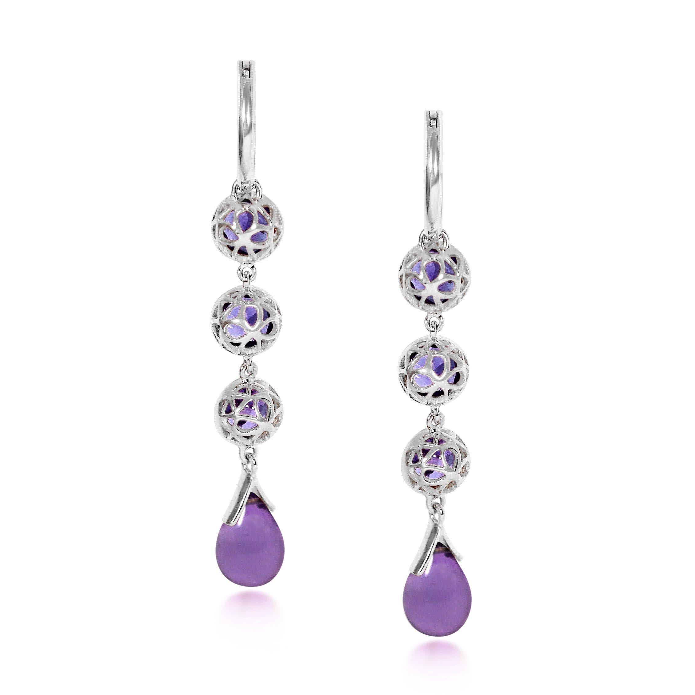 Handcrafted 1.50 Carats Amethysts 18 Karat White Gold Drop Earrings. Our stone cascade-like earrings are an elegant statement underlined by romantic dancing drops carved in Amethyst under a set of 6mm round cut Amethyst stones encased in our iconic
