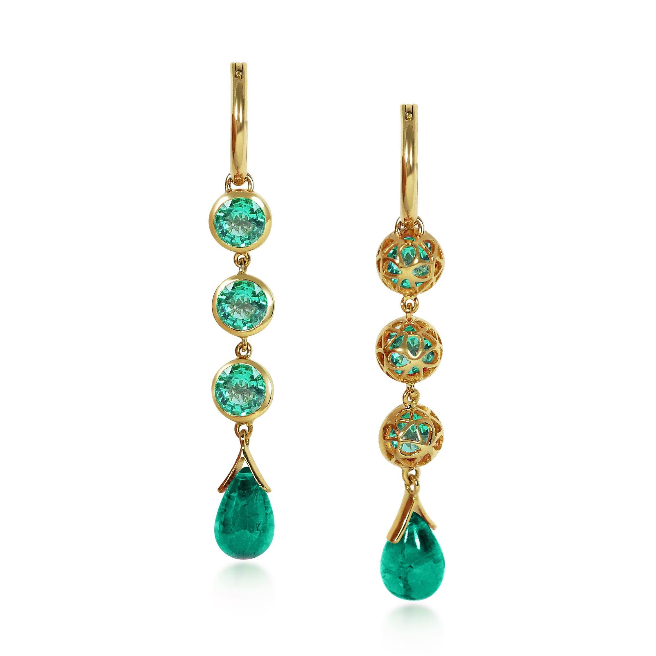 Handcrafted 1.35 Carats Emerald 18 Karat Yellow Gold Drop Earrings. Our stone cascade-like earrings are an elegant statement underlined by romantic dancing drops carved in Emerald under a set of 6mm round cut Emerald stones encased in our iconic