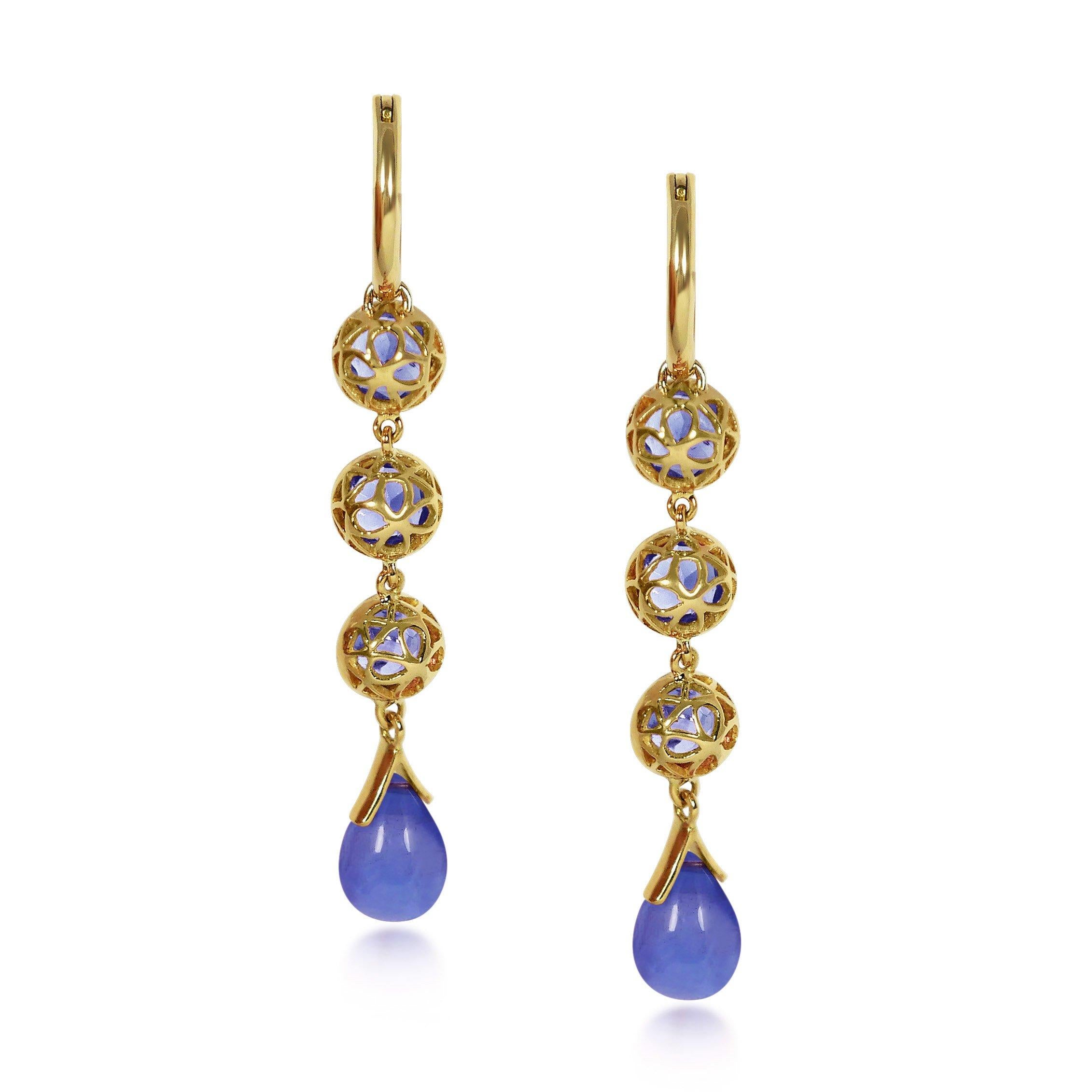 Handcrafted 1.65 Carats Tanzanites 18 Karat Yellow Gold Drop Earrings. Our stone cascade-like earrings are an elegant statement underlined by romantic dancing drops carved in Tanzanite under a set of 6mm round cut Tanzanite stones encased in our