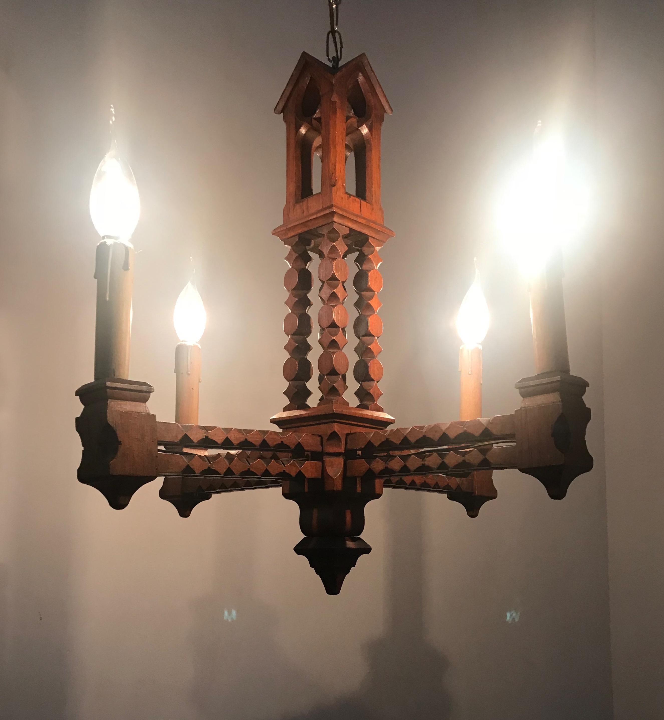 Rare Gothic Revival chapel shape light fixture.

For the collectors and enthousiasts of rare Gothic Revival antiques we also have this beautiful and all-handcrafted, wooden light fixture. This well carved elmwood specimen from circa 1900 with its
