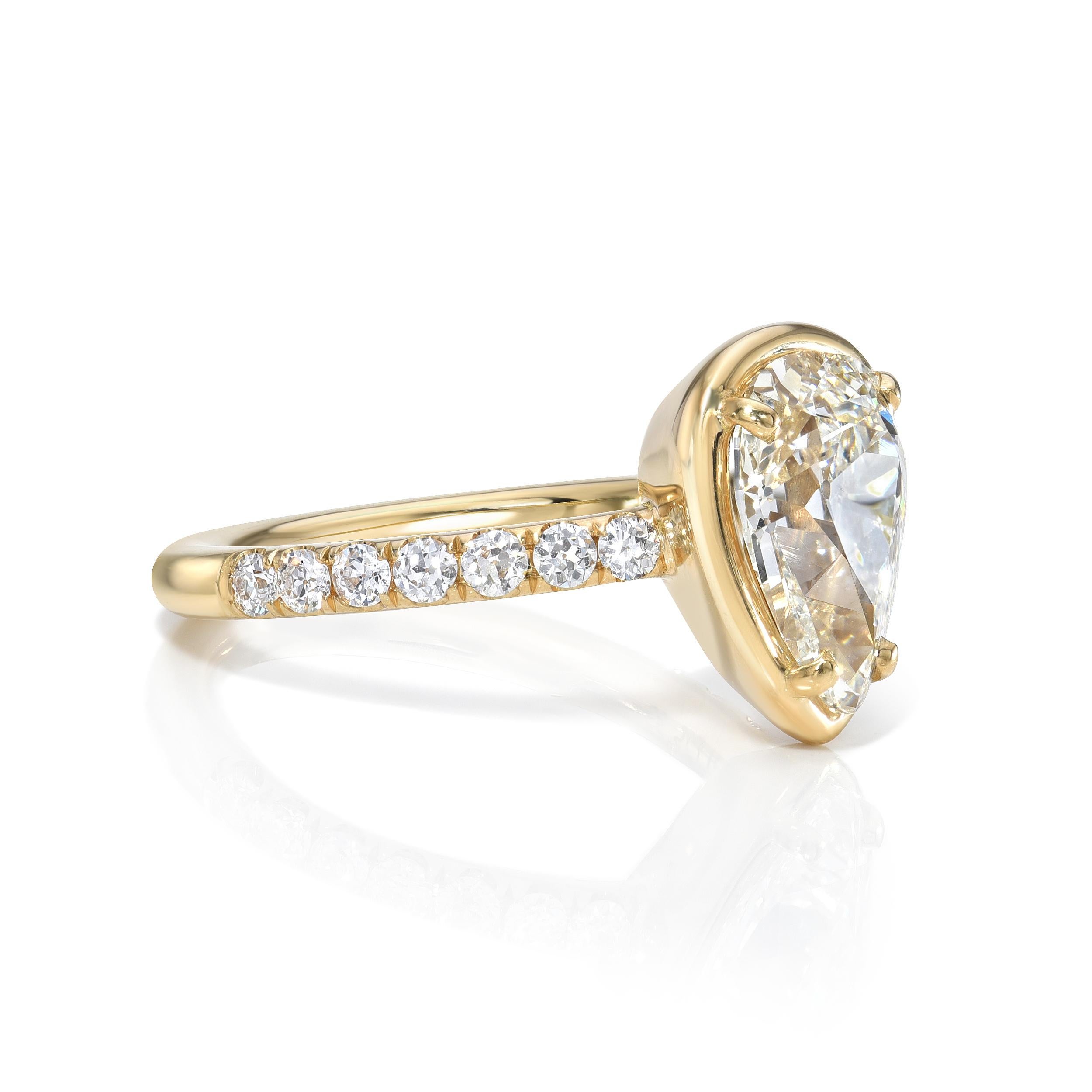 2.13ct H/SI1 GIA certified pear shaped diamond with 0.36ctw old European cut accent diamonds prong set in a handcrafted 18K yellow gold mounting.