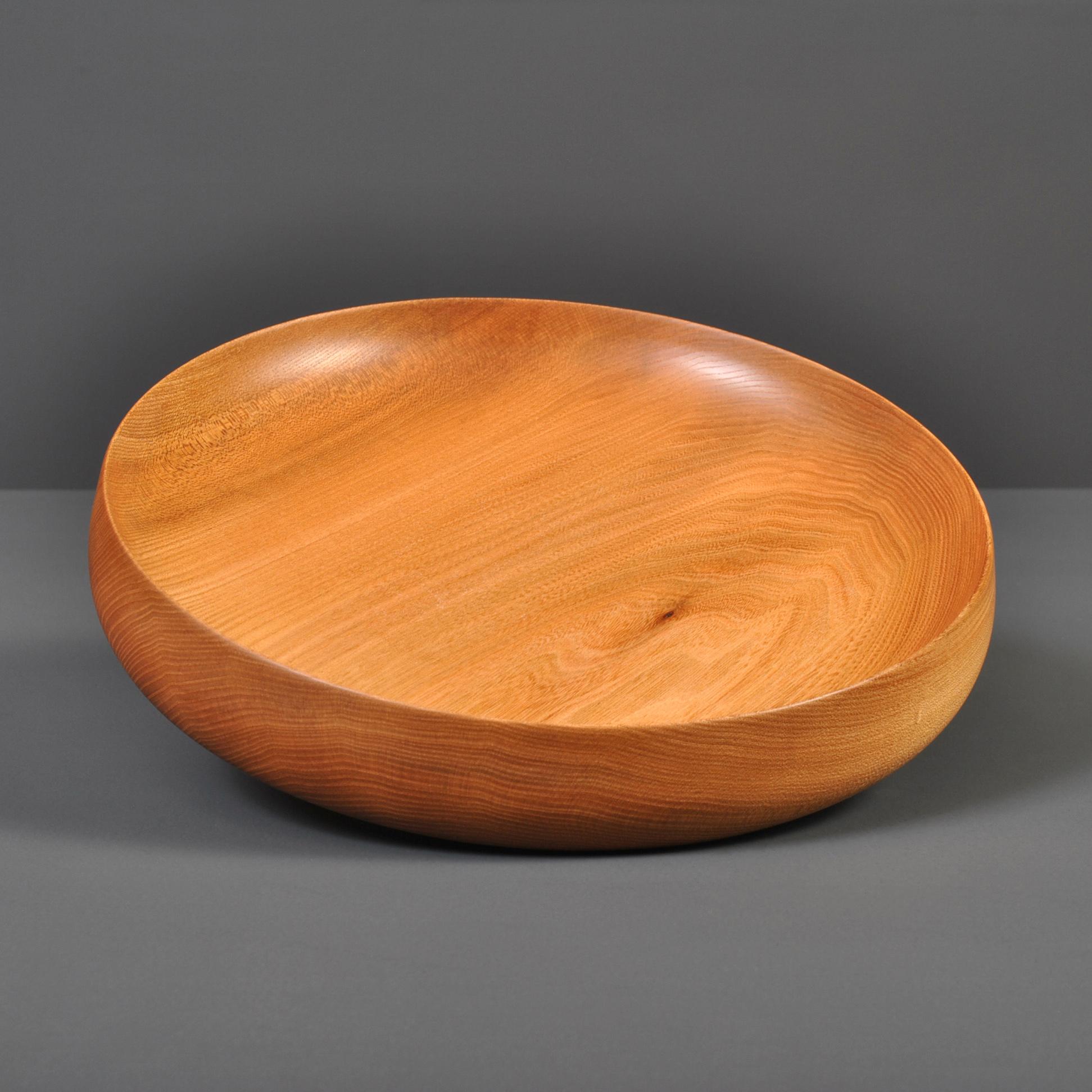 Fine traditionally hand-crafted and turned Elm platter - bowl. These are handmade to the very best quality in London.
Finished in food safe oils.
This bright piece of Scottish Elm was turned by hand to our unique specific platter shape. Inspired by