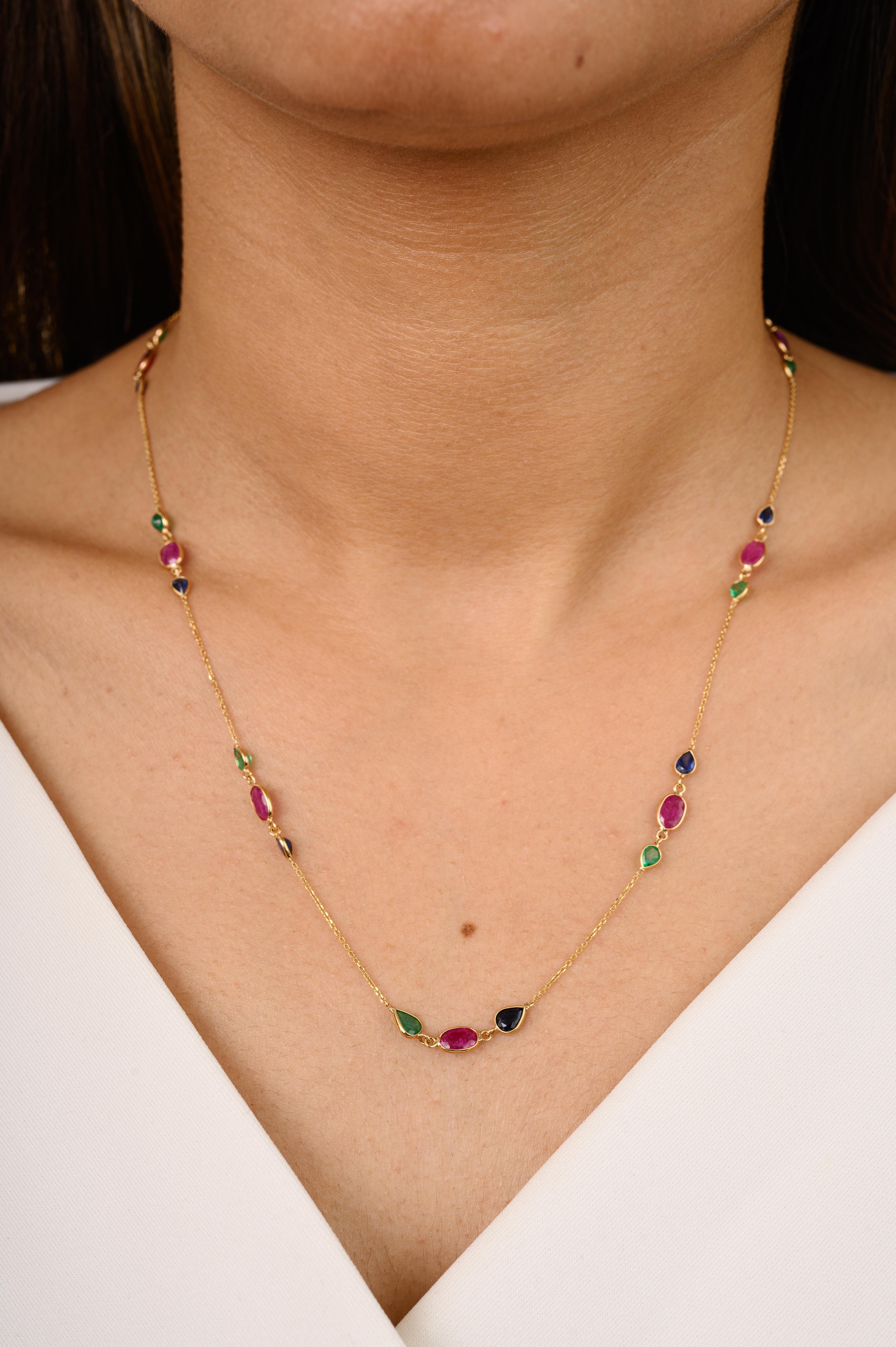 Handcrafted Emerald Ruby Sapphire Chain Necklace in 18K Gold studded with pear and oval cut emerald, ruby and sapphire. This stunning piece of jewelry instantly elevates a casual look or dressy outfit. 
Emerald enhances the intellectual capacity,