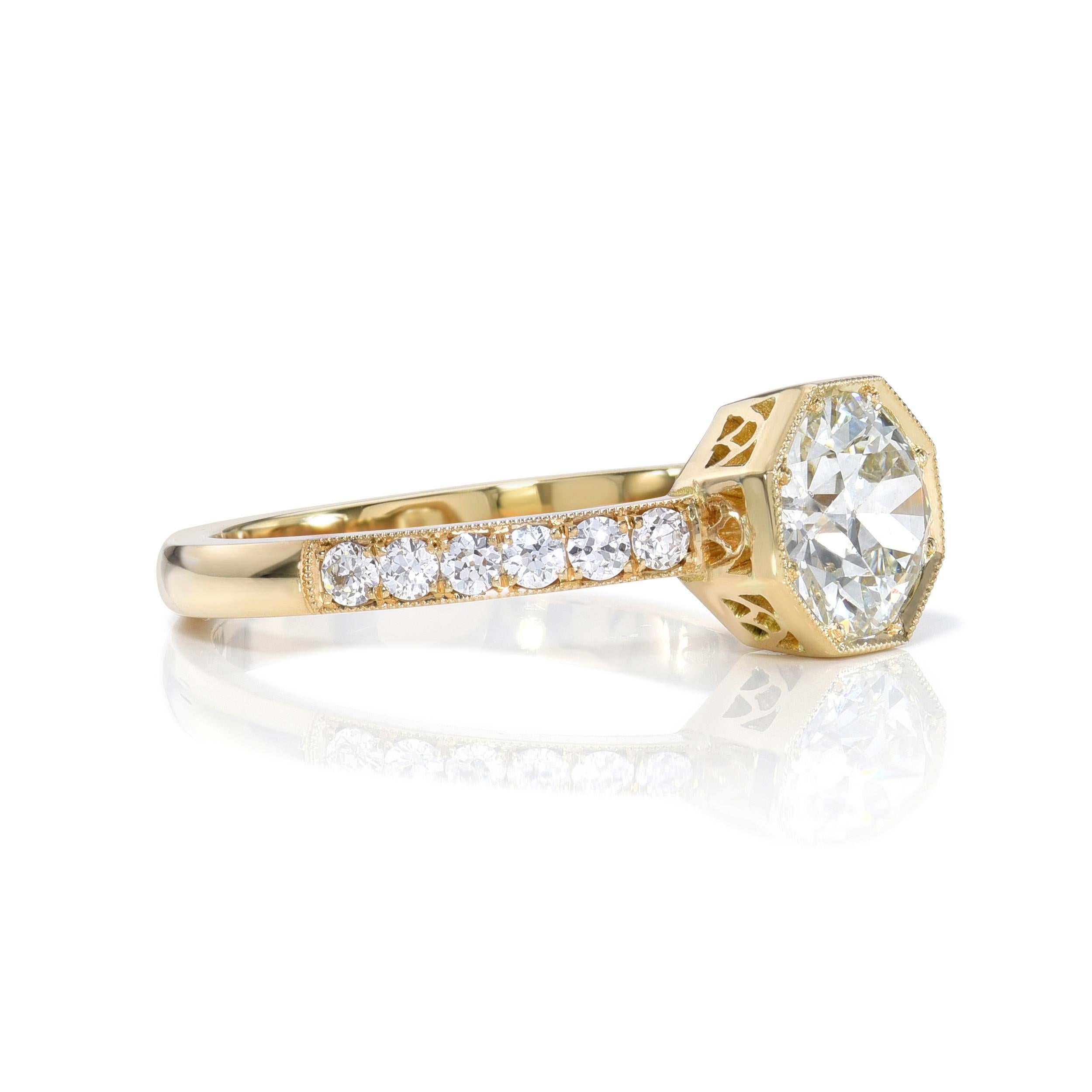 0.90ct J/VS1 GIA certified old European cut diamond with 0.22ctw old European cut accent diamonds prong set in a handcrafted 18K yellow gold mounting.