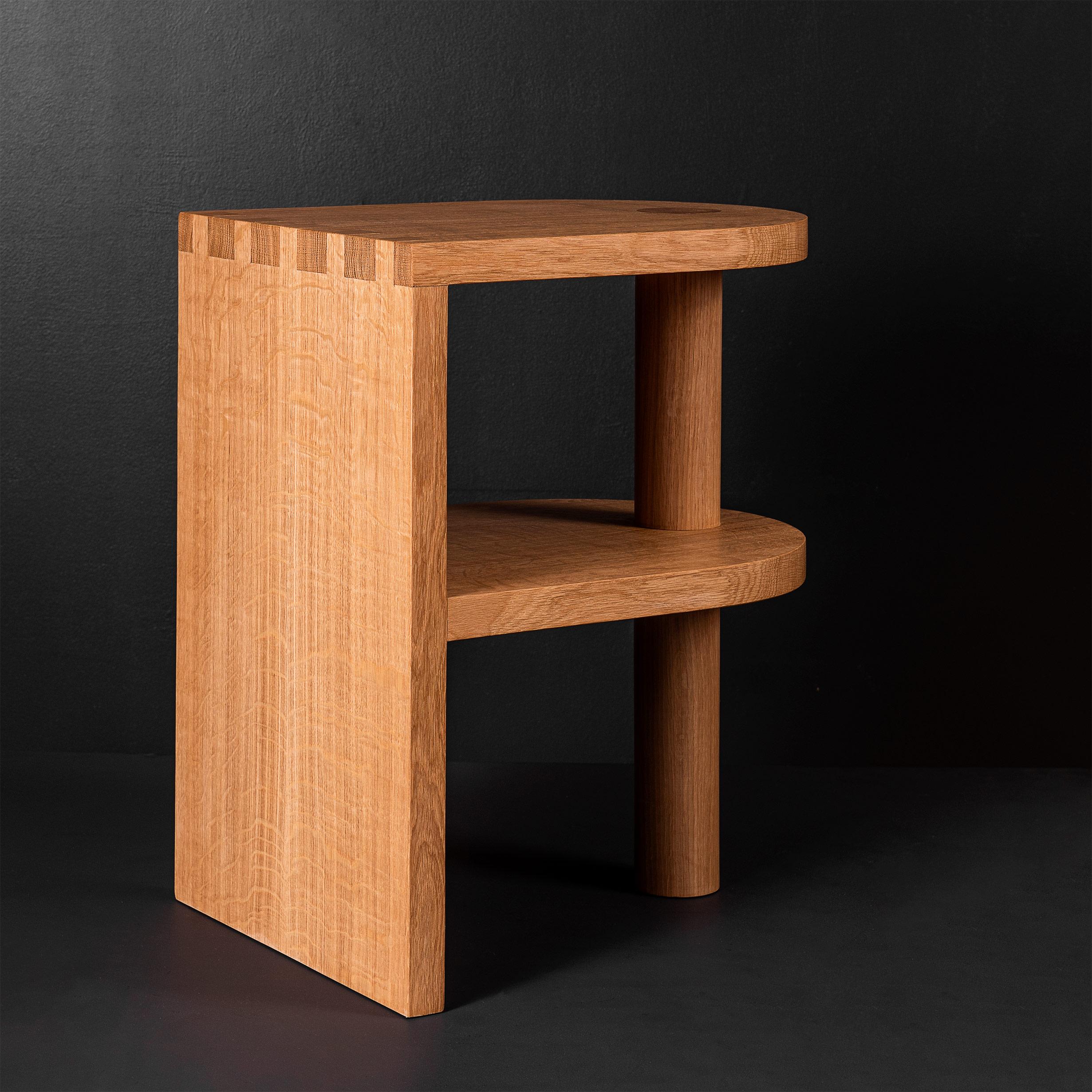 A Larger and adapted version of our architectural postmodern oak pillar nightstands or end tables. Designed and handcrafted in England using traditional woodwork techniques with the most beautiful and finest English quarter-sawn oak. Hand-cut large