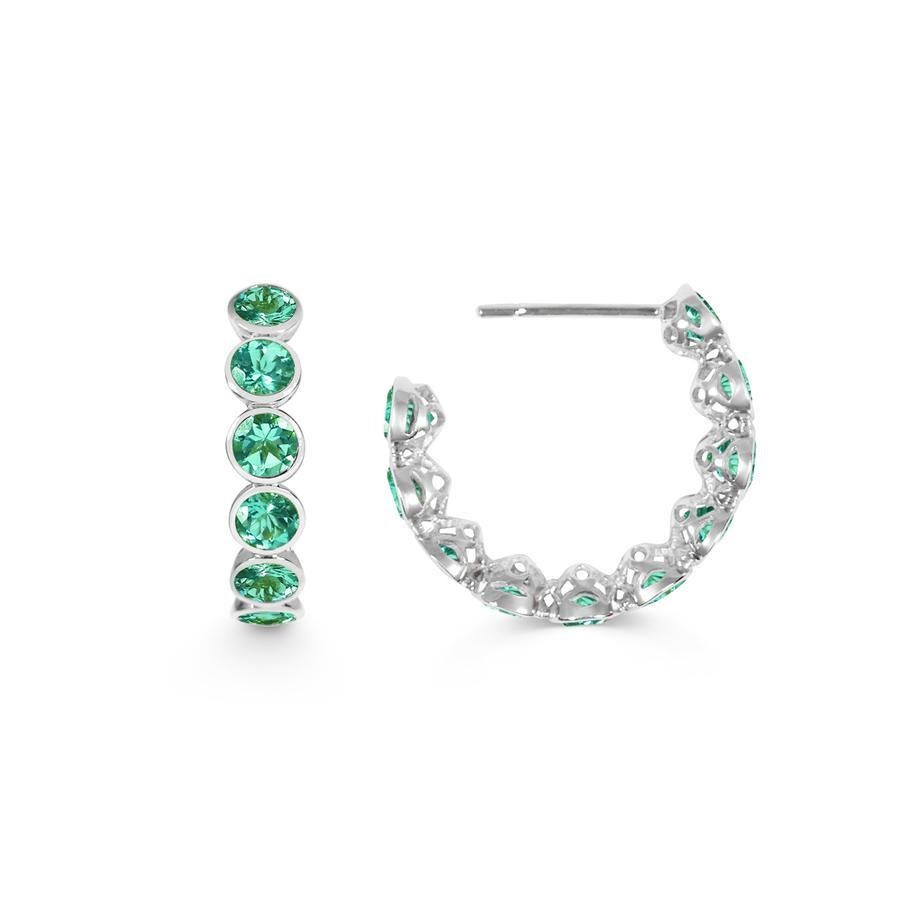 Handcrafted Eternity Hoop Earrings in Emerald and 18 Karat White Gold. Our twist on the Eternity rings - representing everlasting love. Our Eternity hoops are a Romantic statement set in our signature hand pierced lace.

Emeralds are the most