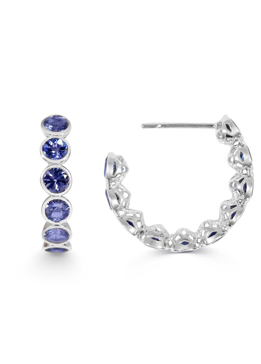 Handcrafted Eternity Hoop Earrings in Tanzanite and 18 Karat White Gold. Our twist on the Eternity rings - representing everlasting love. Our Eternity hoops are a Romantic statement set in our signature hand pierced lace.

Named after their sole