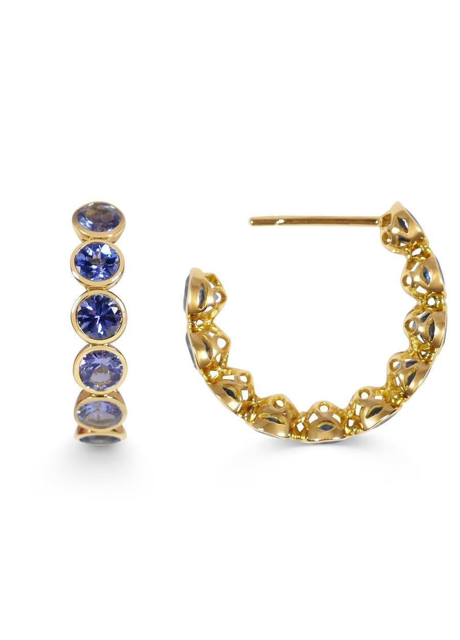 Handcrafted Eternity Hoop Earrings in Tanzanite and 18 Karat Yellow Gold. Our twist on the Eternity rings - representing everlasting love. Our Eternity hoops are a Romantic statement set in our signature hand pierced lace.

Named after their sole