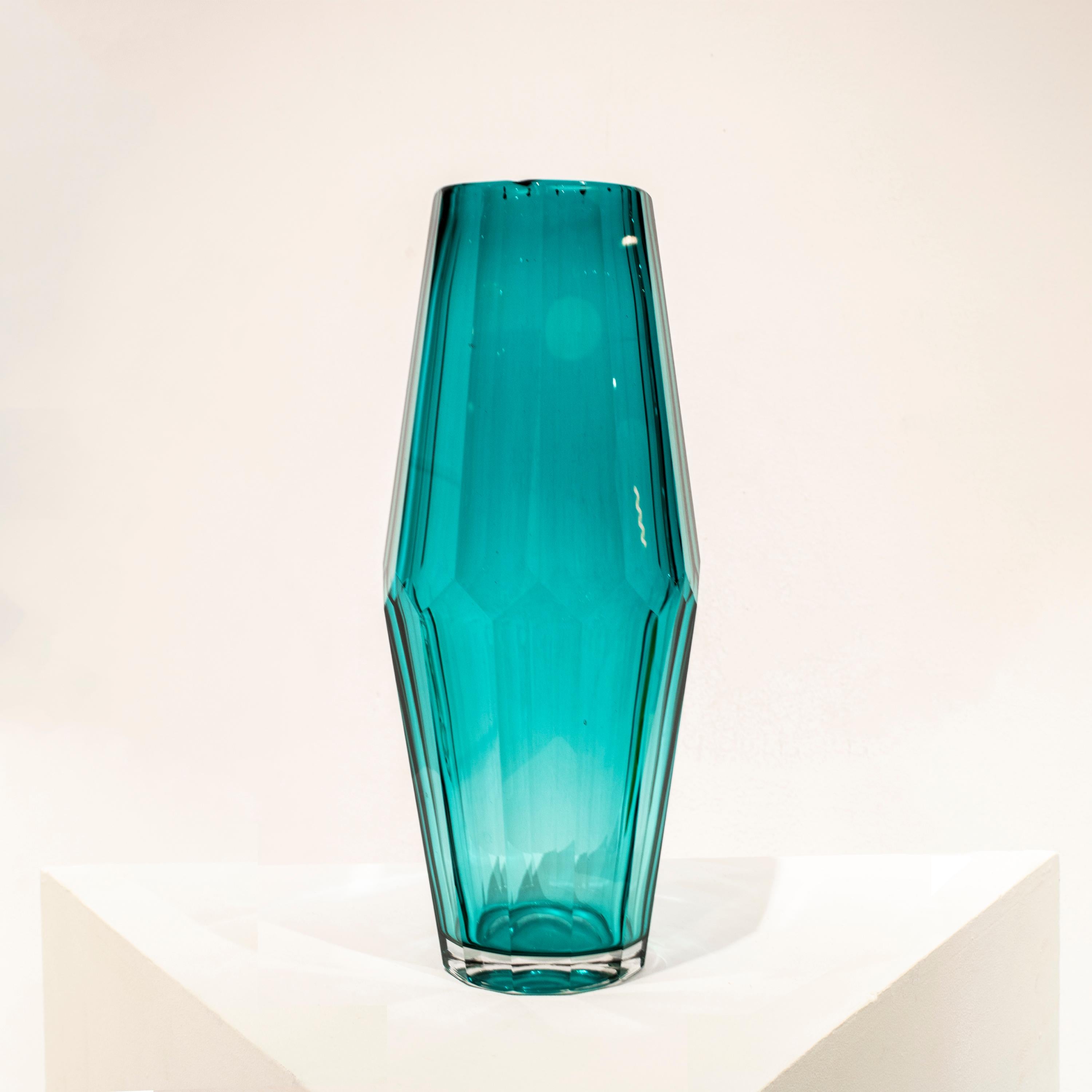 Hand-blown Italian blue semi-transparent glass vase, with a faceted shape.