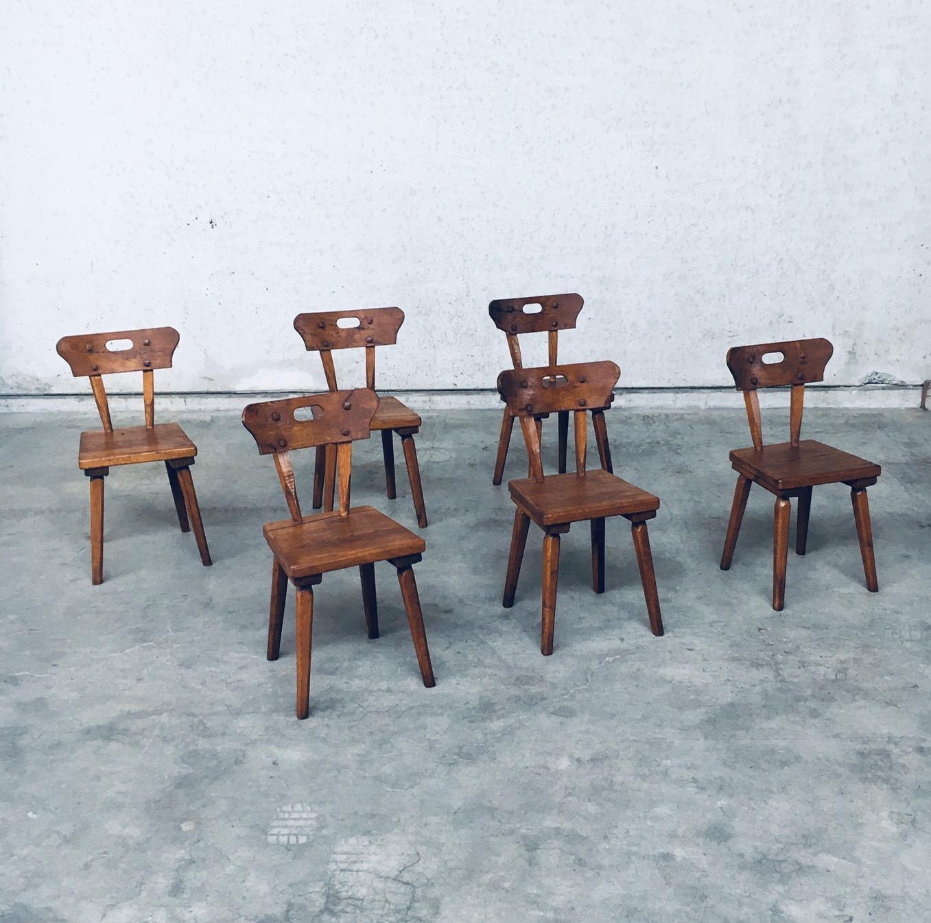 Vintage Handcrafted Folk Art Rustic Oak Dining Chair set of 6. Made in France, 1940s period. Handmade handcrafted and carved solid oak constructed dining chair set. All chairs are in very good condition for their age and use. One chair has some