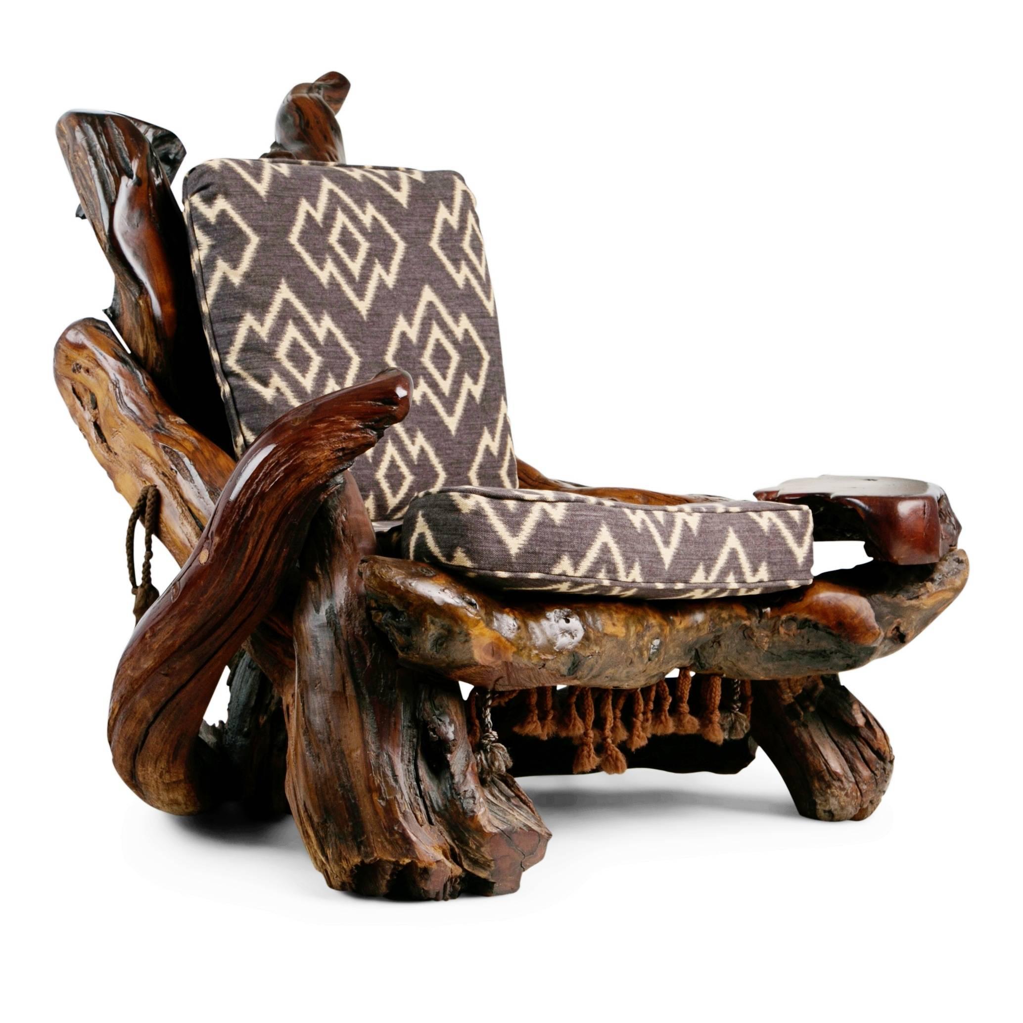 Extraordinary artisan sculptural root wood armchair handcrafted from naturally free-formed burl redwood which has been polished and worked into an impressive lounge chair, in the style of California sculptor Daryl Stokes in the 1970s. The twisted