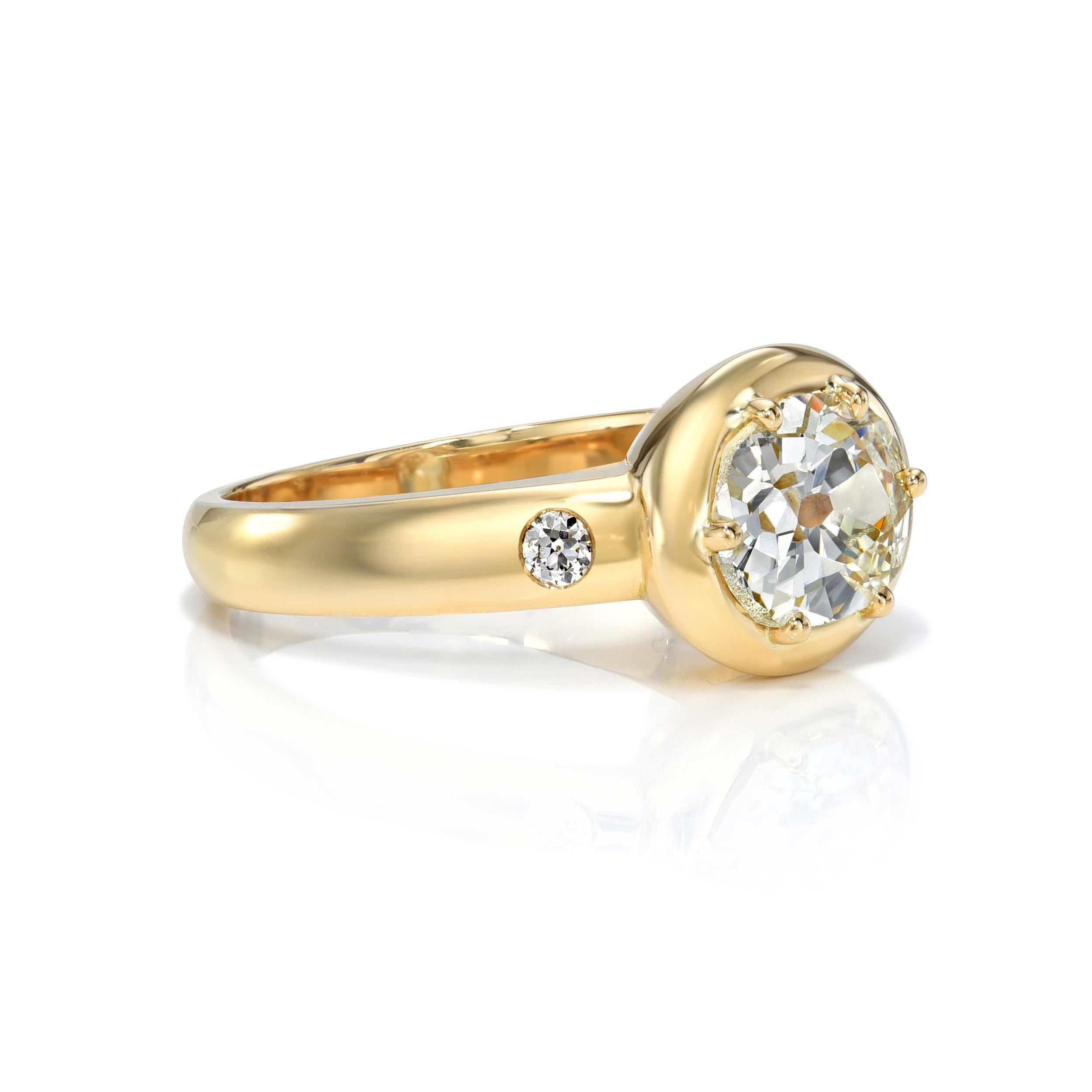 1.55ct L/VS2 GIA certified oval cut diamond with 0.07ctw old European cut accent diamonds prong set in a handcrafted 18K yellow gold mounting.