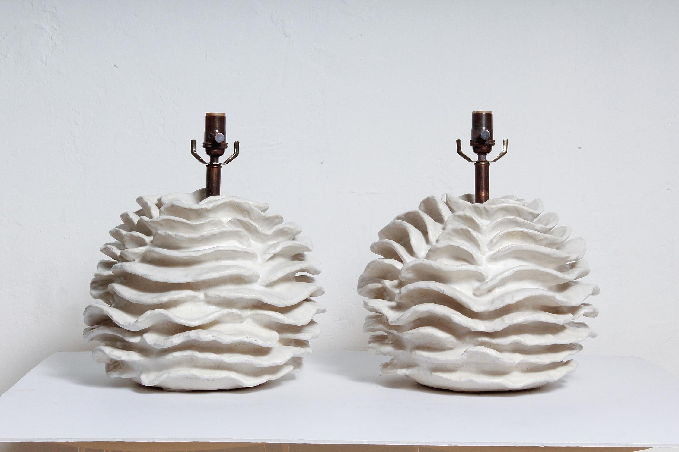 Pair of custom white glazed stoneware lamps, handcrafted exclusively for Stripe by ceramicist Priscilla Hollingsworth. Antiqued brass hardware with white fabric cords.
