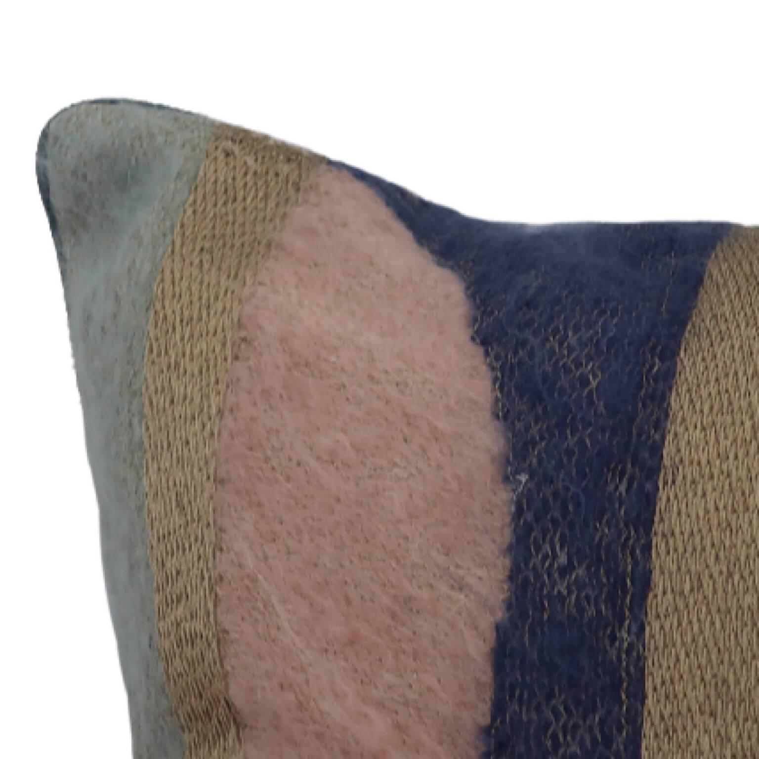 Handcrafted pillow embroidered with mohair yarn and gold metallic threads.