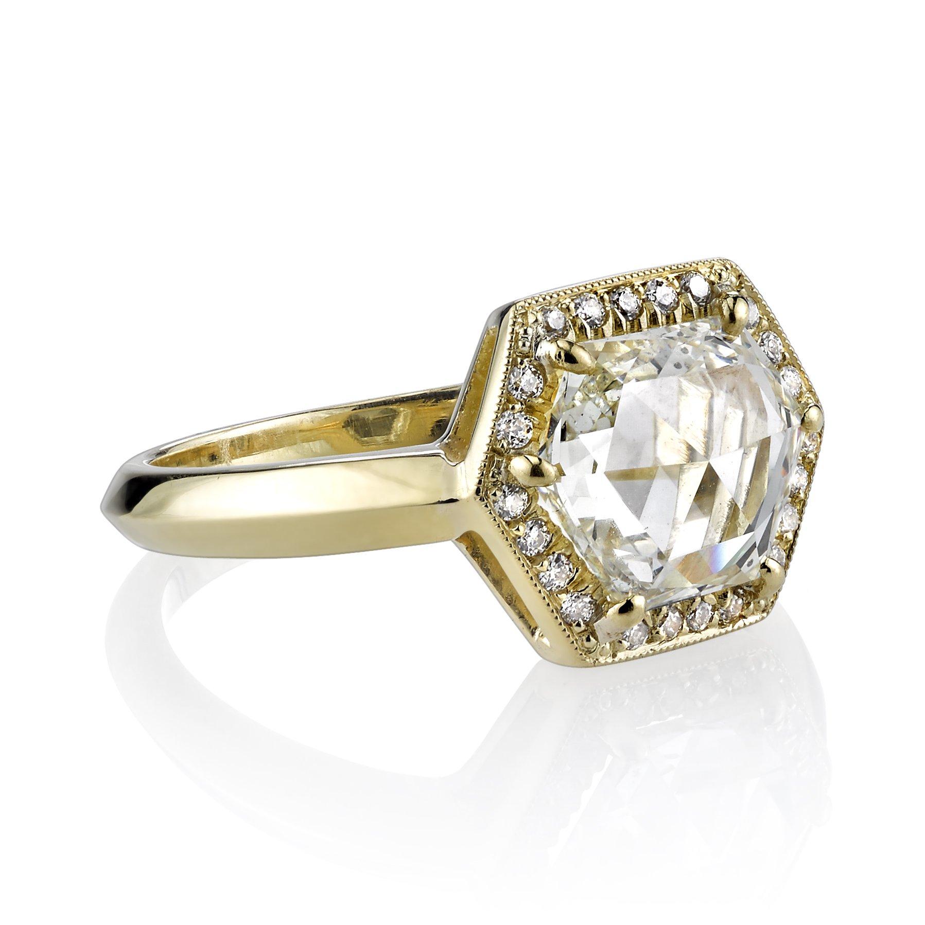 1.66ct J/SI1 GIA certified trapezoid shaped rose cut diamond with 0.13ctw old European cut accent diamonds set in a handcrafted 18K yellow gold mounting. 
