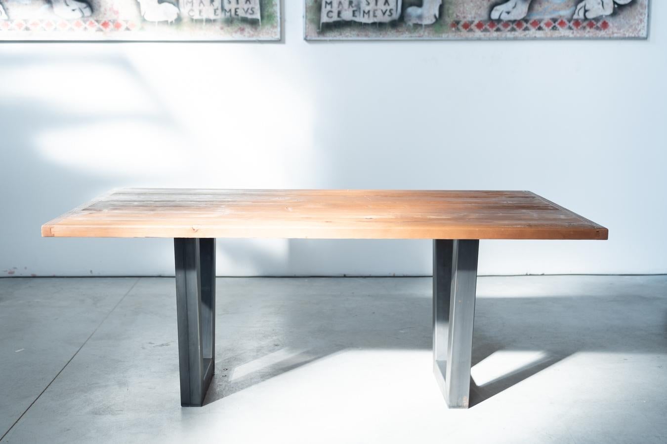 Handcrafted Industrial-Style Dining Table with Brushed Fir Top and Antique Iron Legs (2020)

This stunning handcrafted dining table, produced in 2020, is a perfect fusion of industrial style and artisanal craftsmanship. The brushed fir wood top