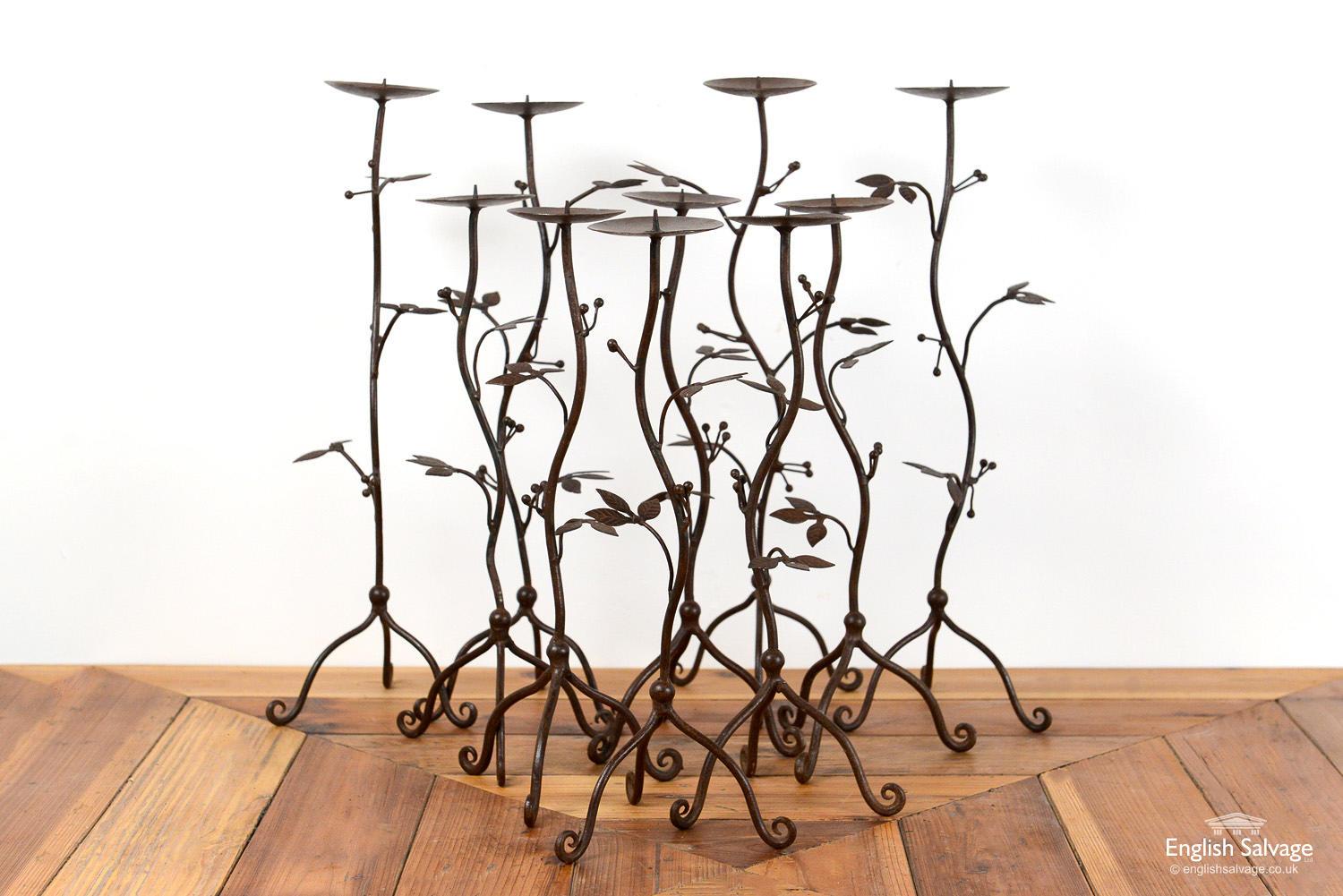 Handcrafted wrought iron candleholders / candlesticks with spikes to hold the candles. Crafted in a foliate and berry design, these look equally striking individually or in a group.