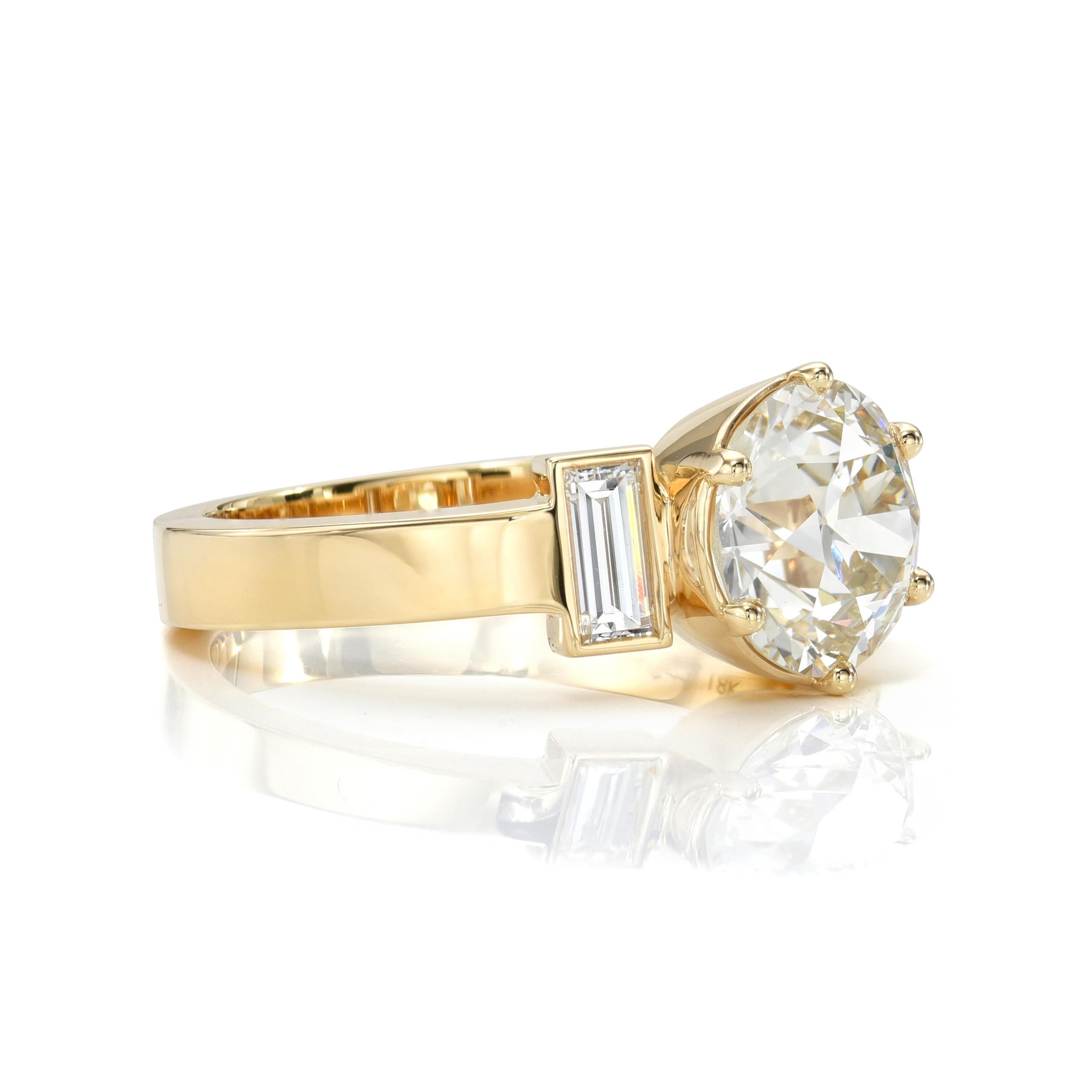 2.20ct L/SI1 GIA certified old European cut diamond with 0.39ctw baguette cut accent diamonds set in a handcrafted 18K yellow gold mounting.