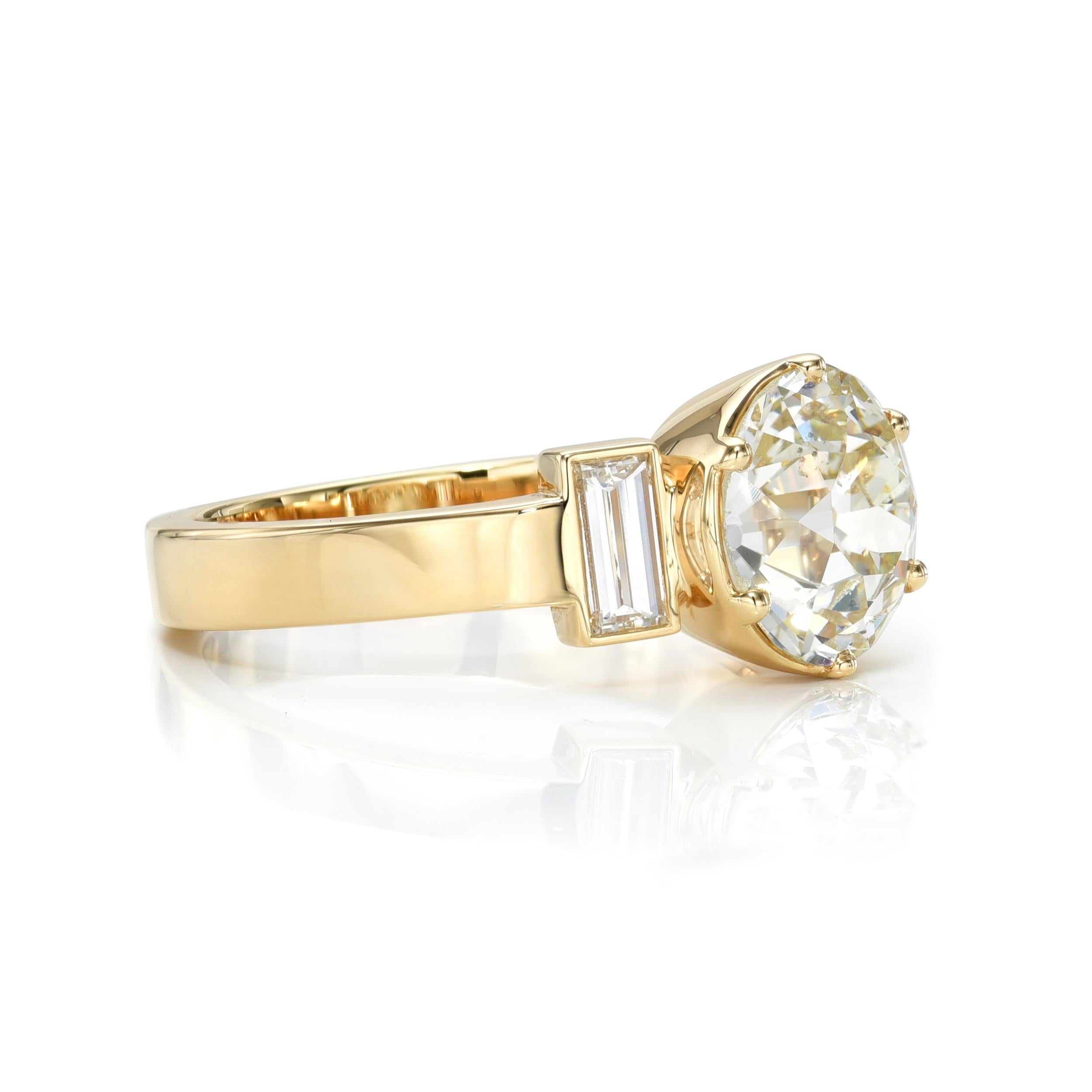 2.42ct M/SI2 GIA certified old European cut diamond with 0.40ctw baguette cut accent diamonds set in a handcrafted 18K yellow gold mounting.