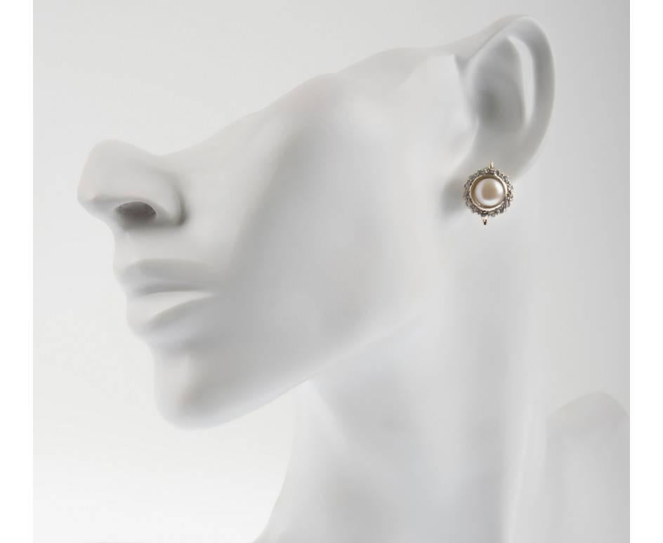 GEMMOLOGIST'S NOTES
This beautifully crafted ladies cultured pearl and diamond cluster earrings, handcrafted by third generation Italian goldsmiths in Naples, Italy. The perfect pair for a brides special day. 

Each features a 7.8mms cultured pearl,
