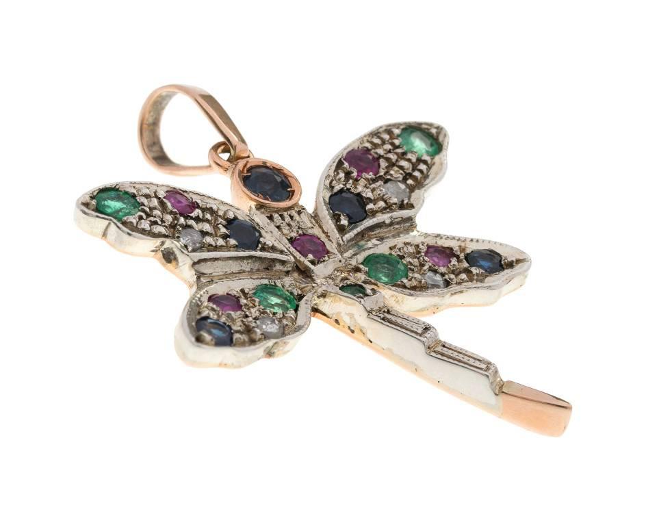 GEMMOLOGIST'S NOTES
This beautifully crafted dragonfly pendant handcrafted by third generation Italian goldsmiths in Naples, Italy.

Inspired by the Victorians, this fabulous dragonfly is encrusted with ruby, emerald and sapphires, set in white