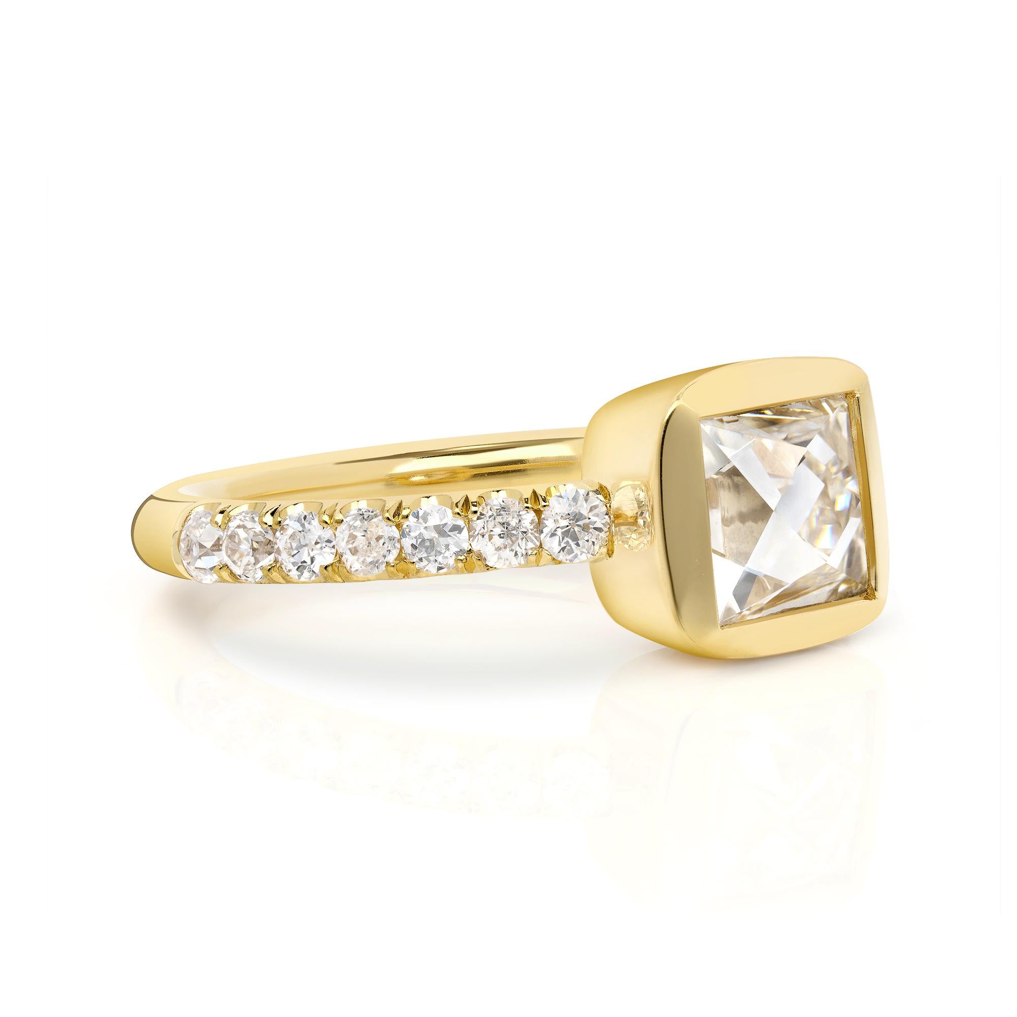 1.39ct J/VS1 GIA certified French cut diamond with 0.43ctw old European cut accent diamonds set in a handcrafted 18K yellow gold mounting.

 
