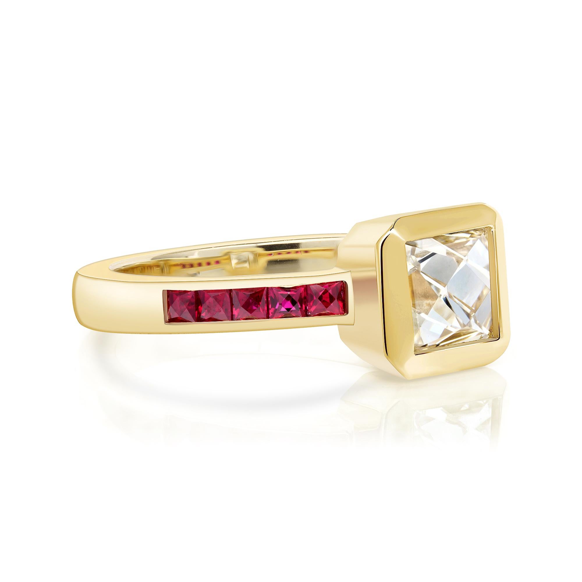 1.16ct G/VS2 GIA certified French cut diamond with 0.42ctw French cut ruby accent stones bezel set in a handcrafted 18K yellow gold mounting.