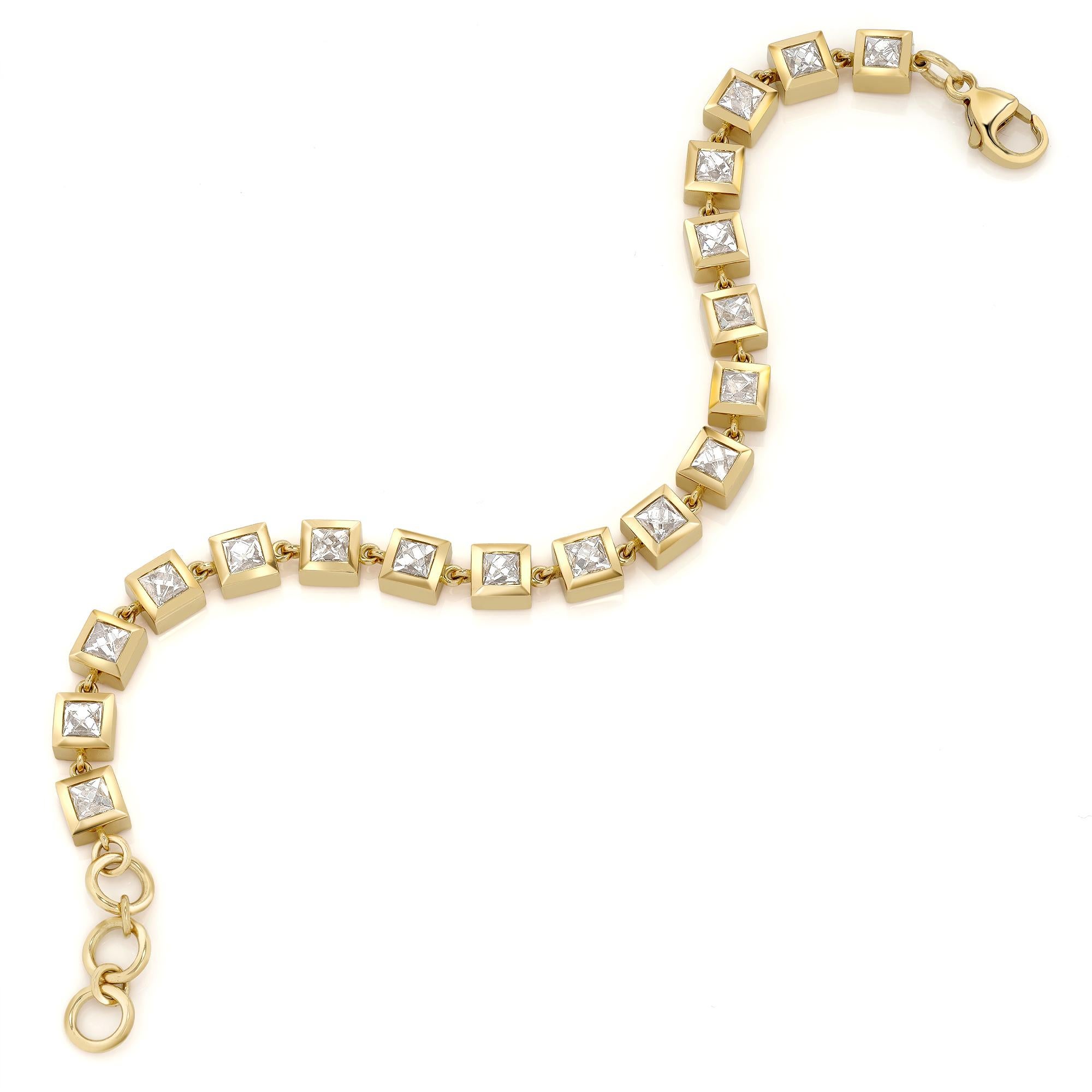 8.65ctw H-I/SI-VS French cut diamonds bezel set in a handcrafted 18K yellow gold bracelet.

Bracelet measures 7.5