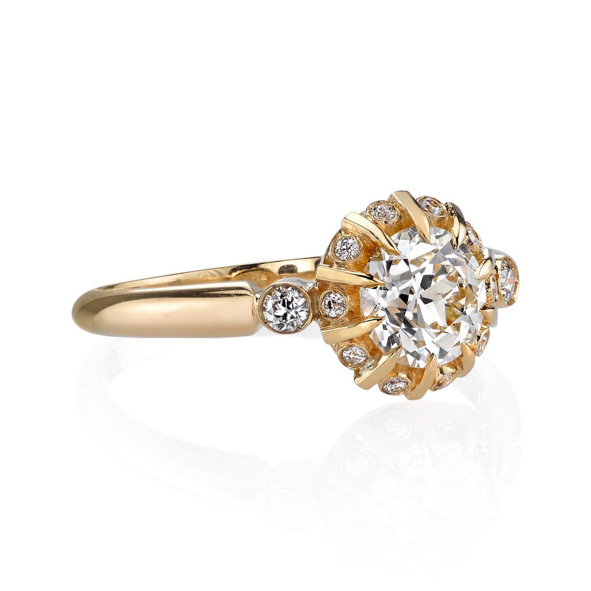 0.93ct J/VS2 GIA certified old European cut diamond with 0.11ctw old European cut diamond accents set in a handcrafted 18K yellow gold mounting.