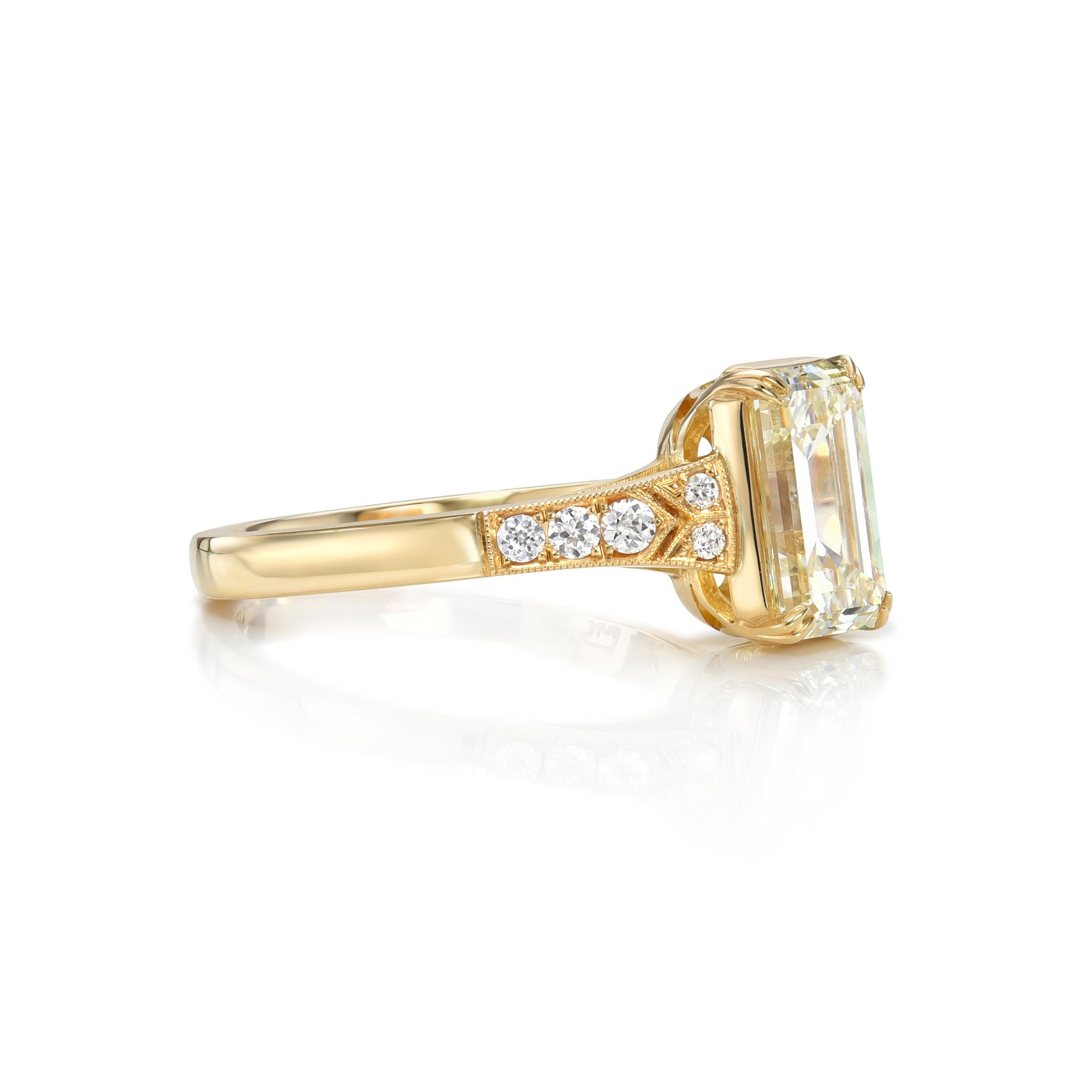 2.00ct M/VS2 GIA certified emerald cut diamond with 0.10ctw old European cut accent diamonds set in a handcrafted 18K yellow gold mounting.