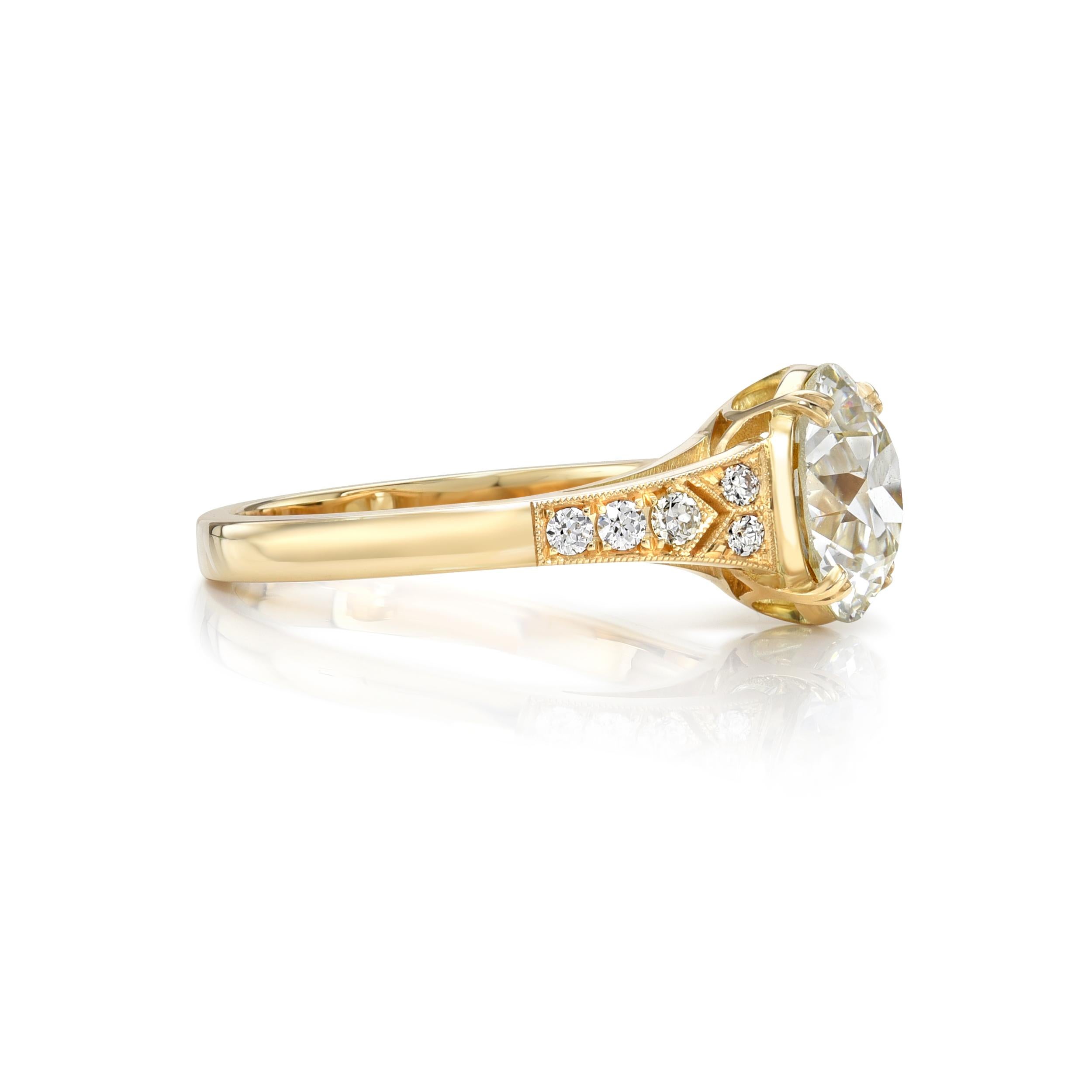 2.37ct K/VVS2 GIA certified old European cut diamond with 0.09ctw old European cut accent diamonds prong set in a handcrafted 18K yellow gold mounting.