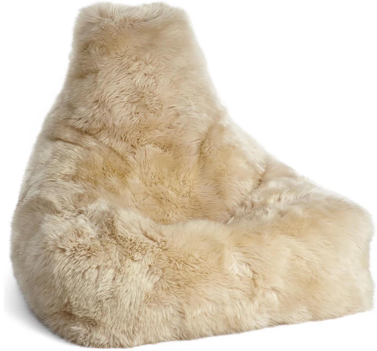 This luxurious beanbag chair combines Nordic craftsmanship with natural comfort. Handcrafted in Denmark, it is upholstered in the highest quality New Zealand sheepskin with a soft calf-leather backing. The long, silky wool — measuring approximately