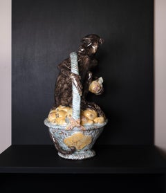 Handcrafted Majolica Garden Figure - Monkey on a basket of fruit, handpainted