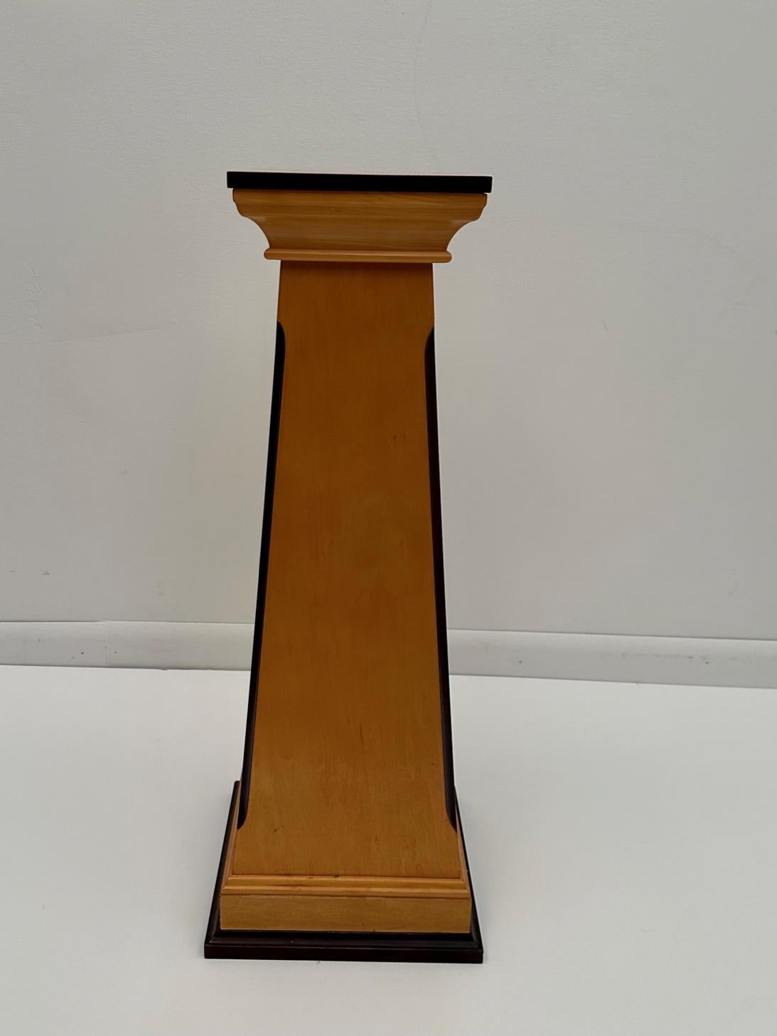 Sleek handcrafted maple pedestal with ebonized details; great for display.Top is 8.25 square.