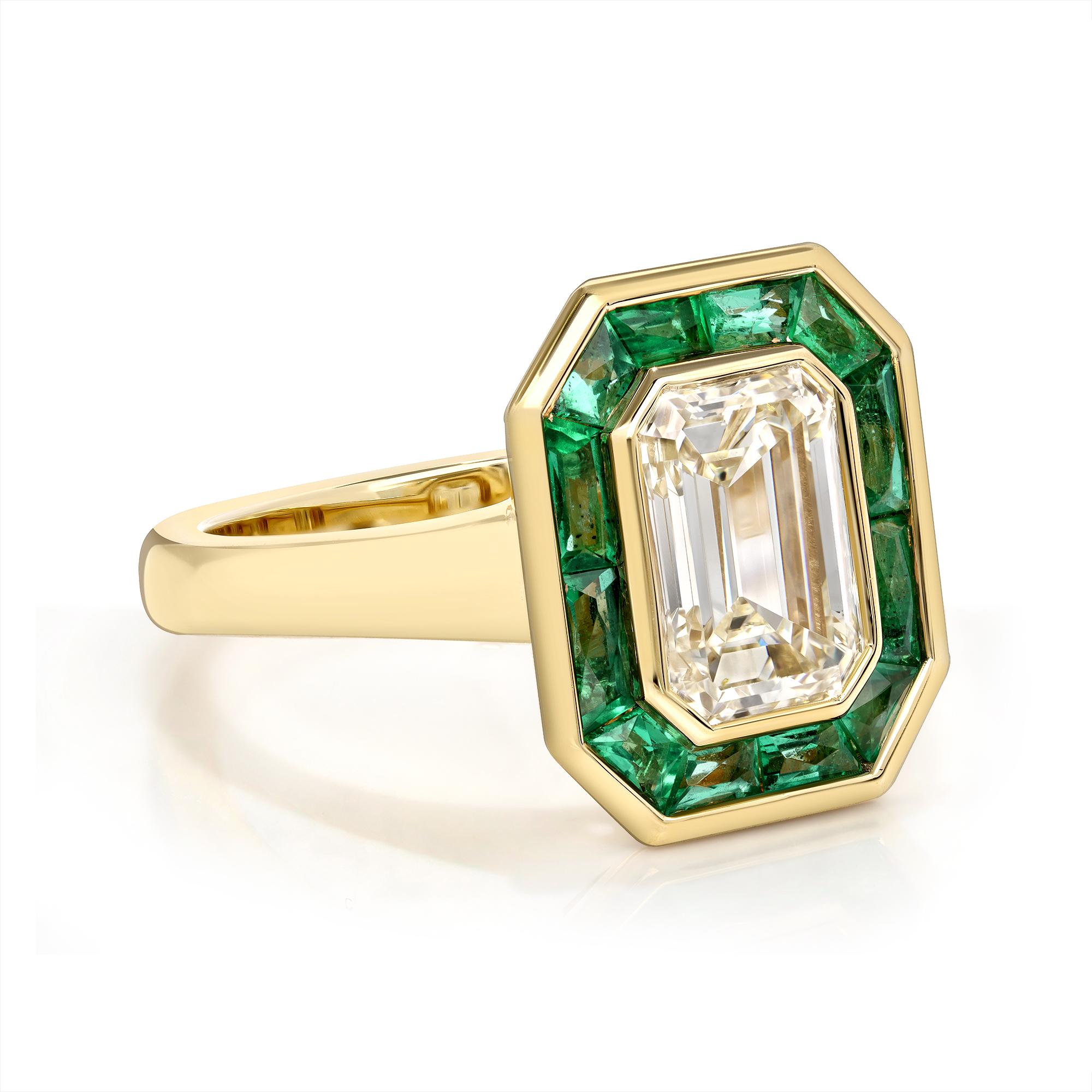 2.11ct N/VS1 GIA certified emerald cut diamond with 0.92ctw French cut emeralds bezel set in a handcrafted 18K yellow gold mounting.