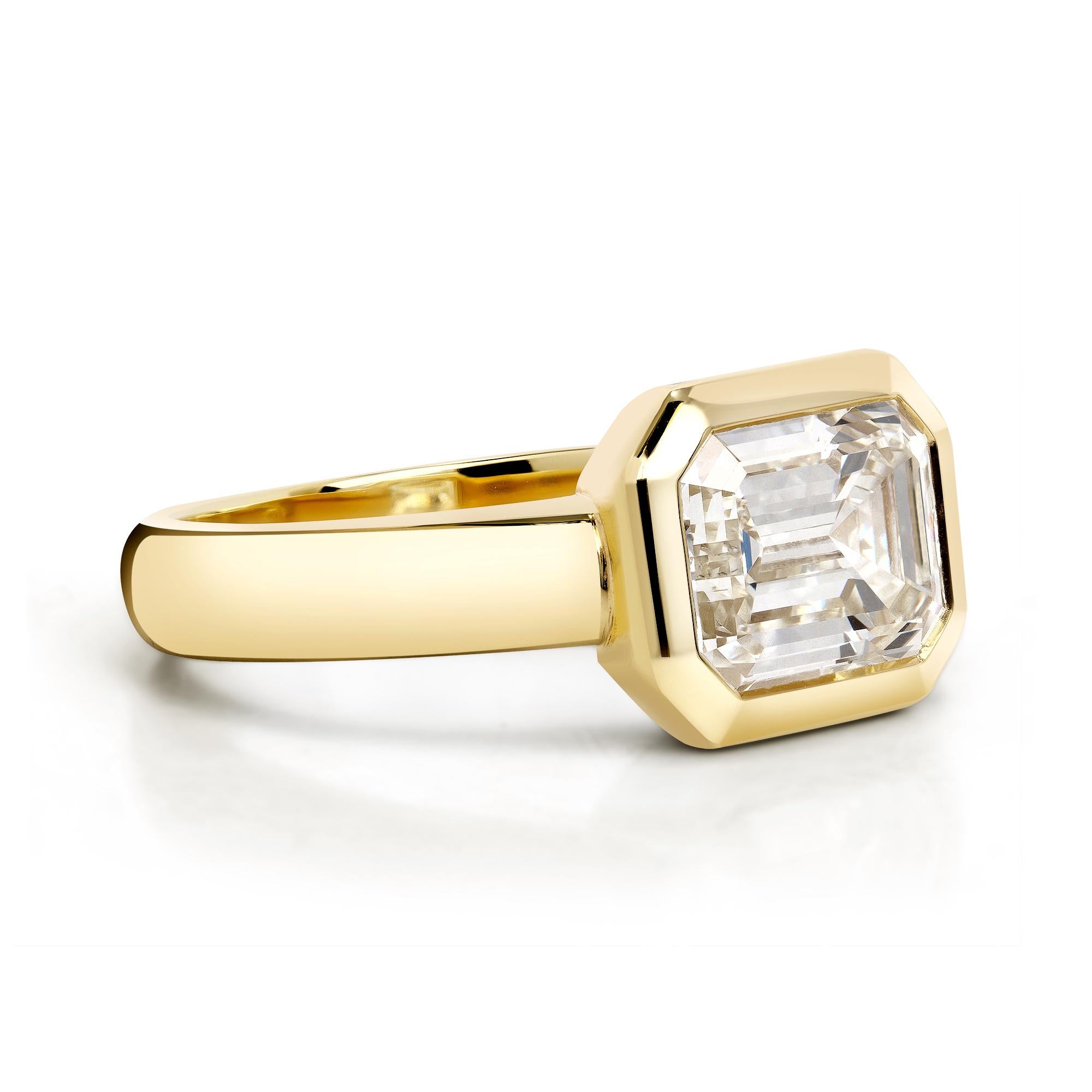 2.14ct L/VS1 GIA certified emerald cut diamond bezel set in a handcrafted 18K yellow gold mounting.