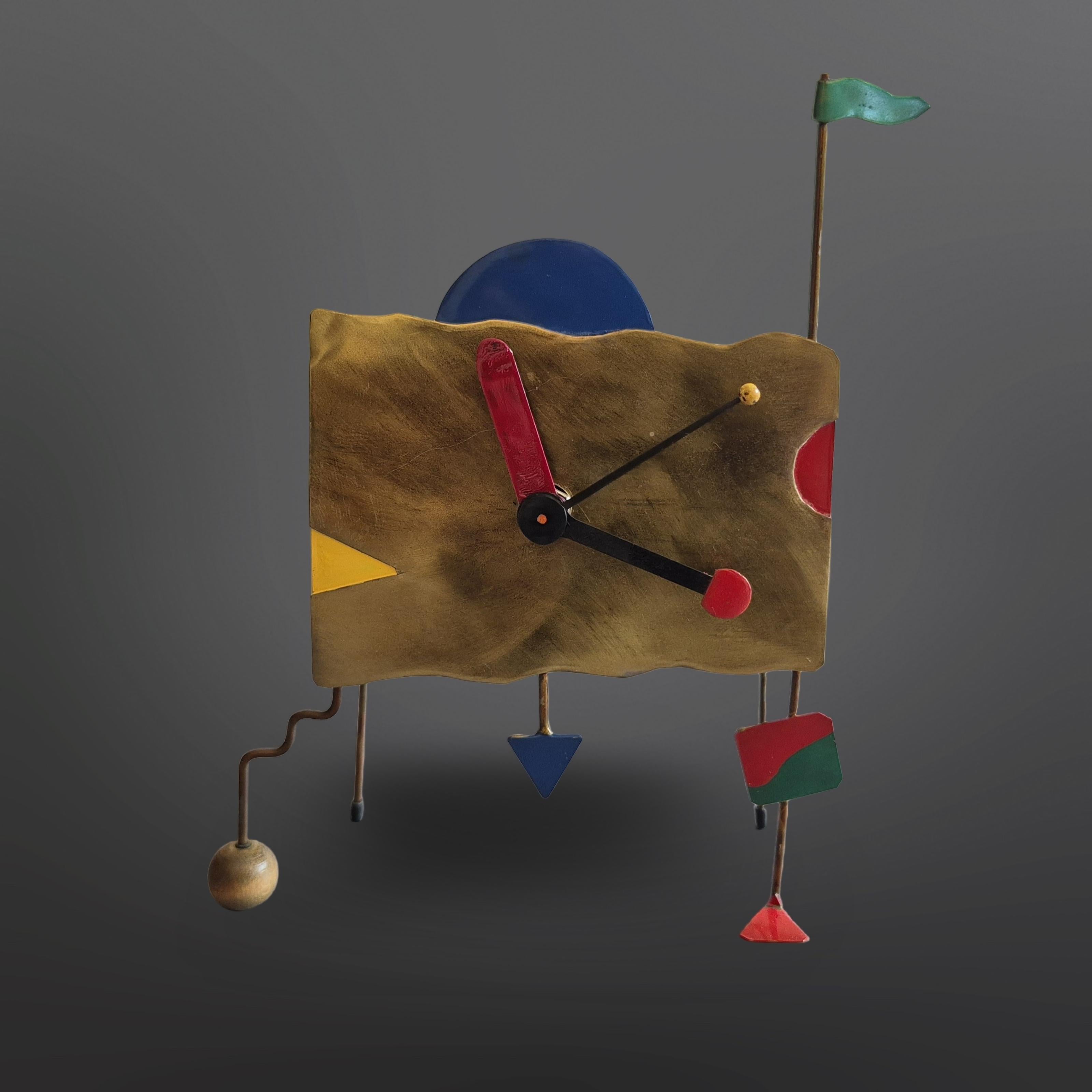 Hand crafted table clock. The housing has been hand made from copper plate and  opper wire. The details are painted in primary colors giving it the distinctive Memphis 