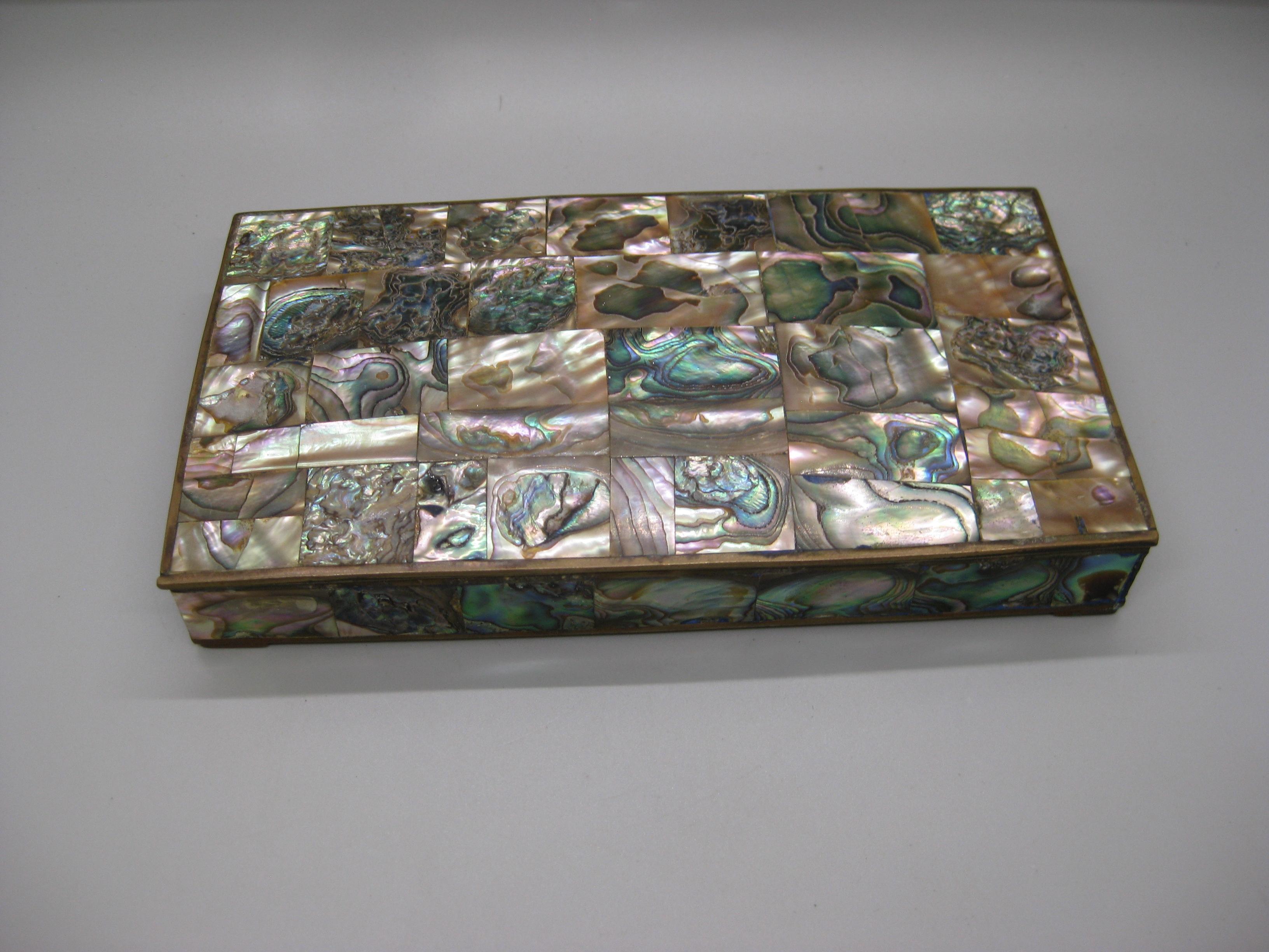 Beautiful decorative handcrafted brass and natural abalone shell tessellated tile inlay cigarette stash/trinket box. The box has a wonderful form and design. Made in Mexico and is marked on the bottom. Has abalone shell on the dome top and sides of