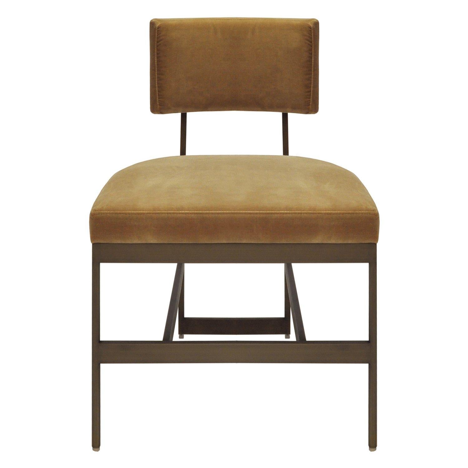 Available as a set of 6, these high end dining chairs are durably produced with a solid structure upholstered in a premium quality camel velvet. Each frame is produce with welded metal and finished in an antique bronze that compliments the color and