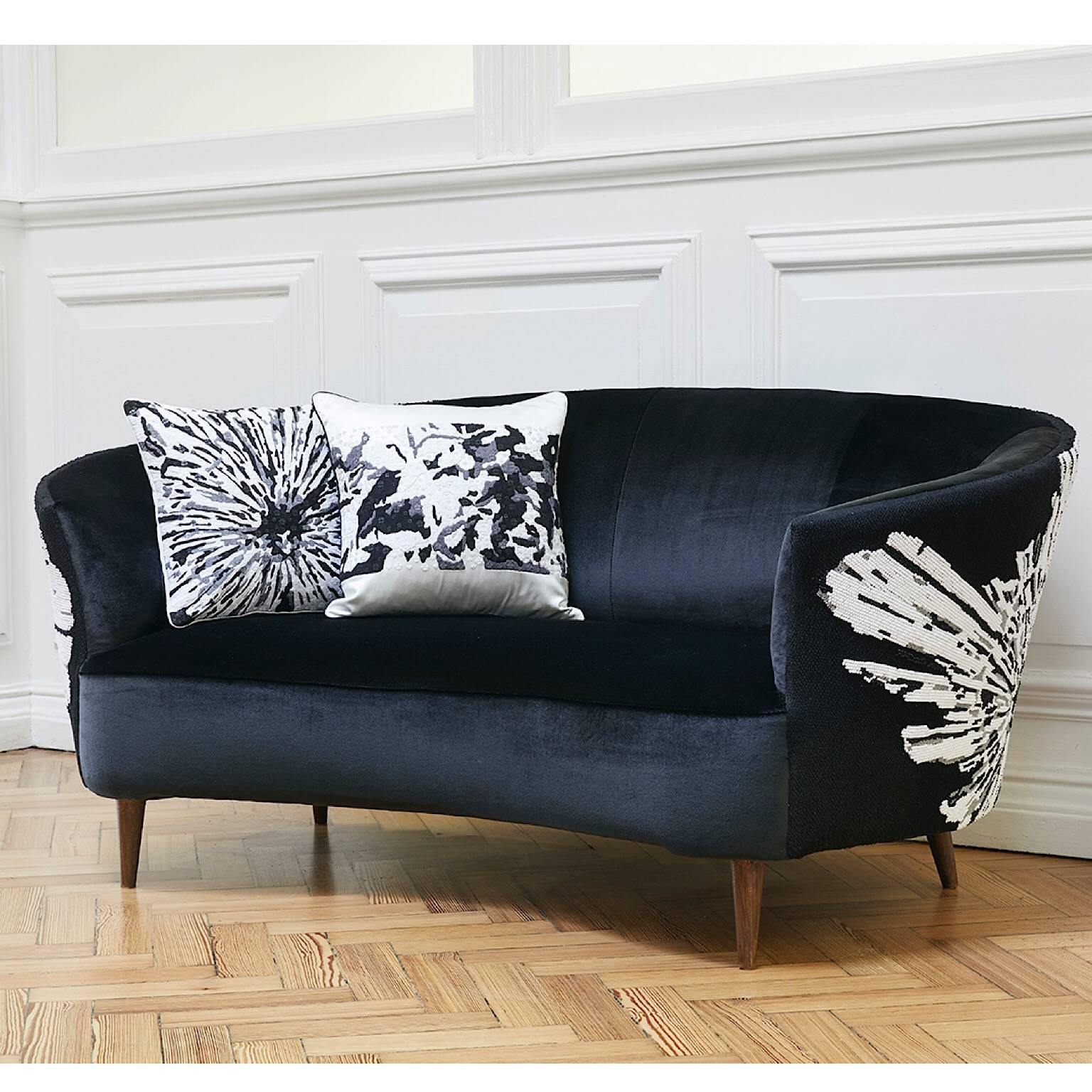 Midcentury Sofa upholstered in black Dedar Splendido velvet with a hand embroidered back.
The embroidery design is an abstract floral using black ,white and transparent super Matt beads
The background is embroidered in a black cotton twisted chain