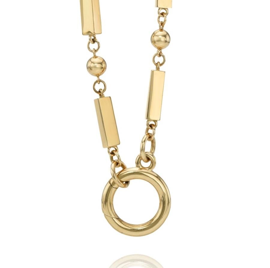 Handcrafted 18K yellow gold alternating solid rectangular link and bead necklace with round charm enhancer.

Necklace measures 22