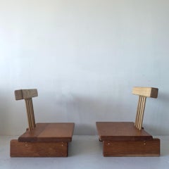 Handcrafted mixed wood low chairs with cantilevered spindle back and tiered base