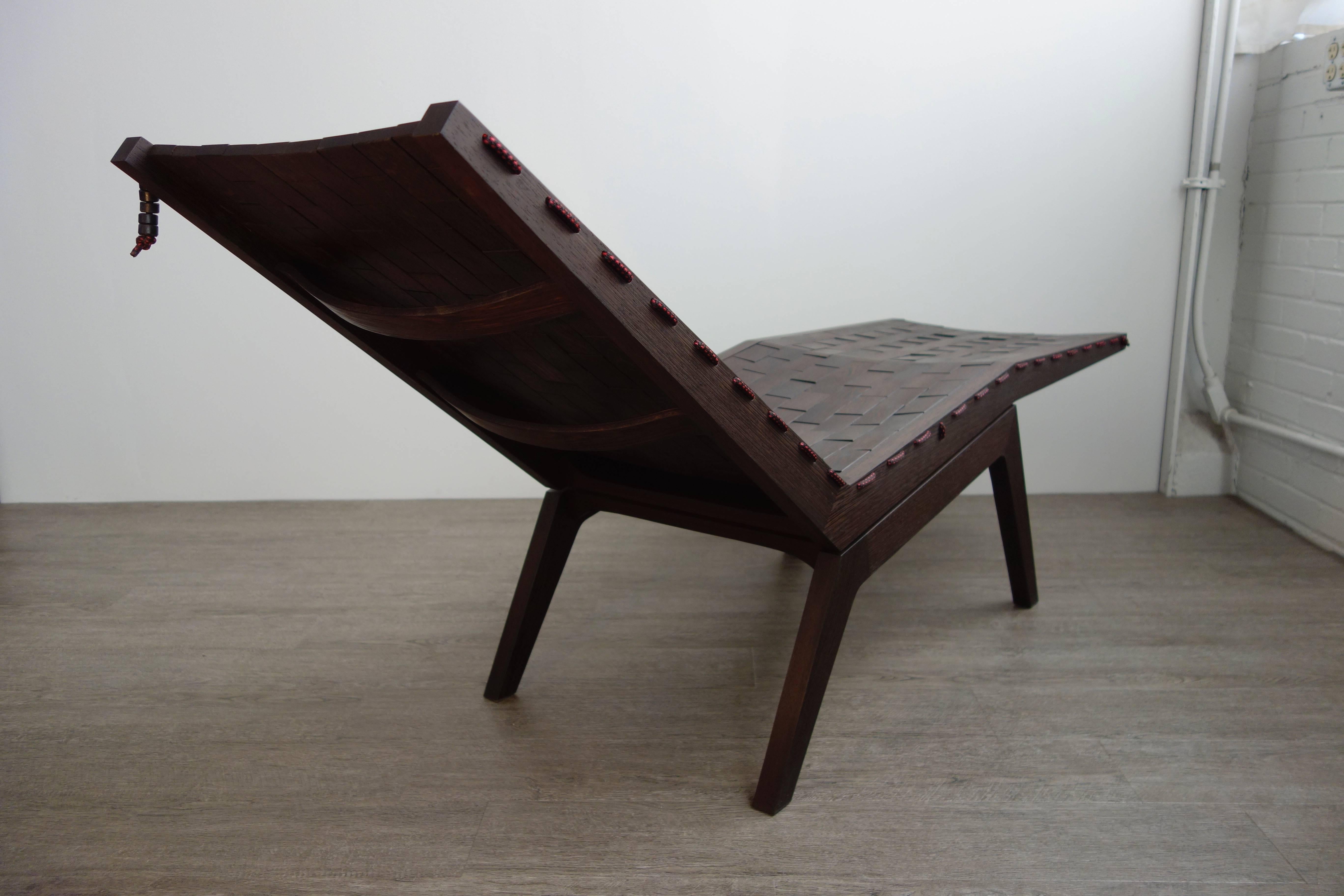Woodsport RB chaise longue. Named after the running bond pattern in which bricks are laid. 207 individual pieces of wenge, a prized African hardwood, are laced together with high grade polyester rope, creating a flexible surface that forms to the