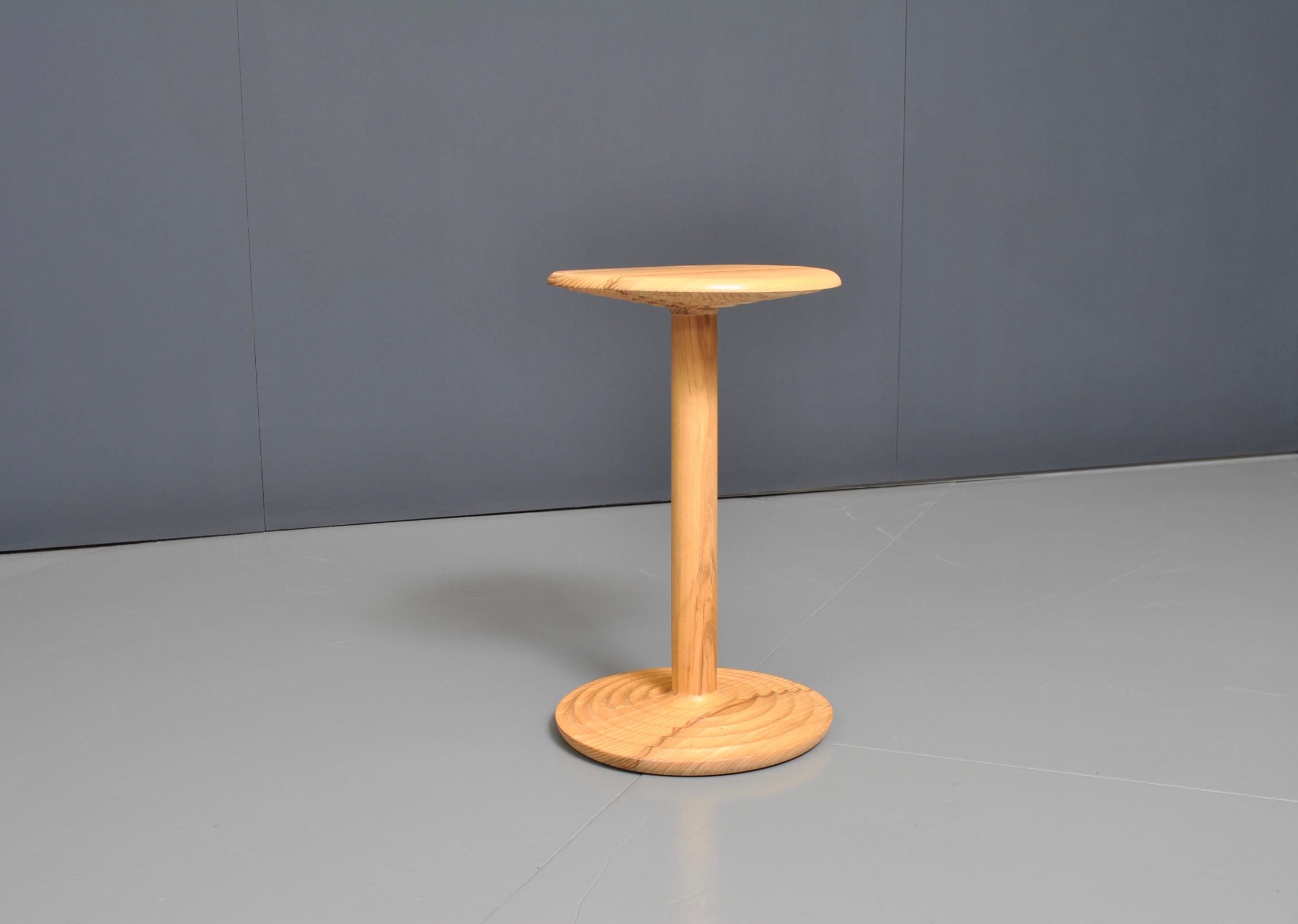 Beautifully turned and handcrafted white ash side table in modernist midcentury design. Perfect in form and scale. This is a bespoke piece of fine quality, handmade by a master-craftsman in solid veined Ash.


We design bold and distinctive pieces