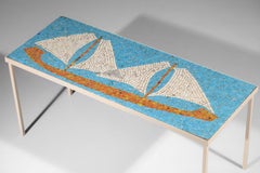 Handcrafted mosaic coffee table decorated with a sailboat