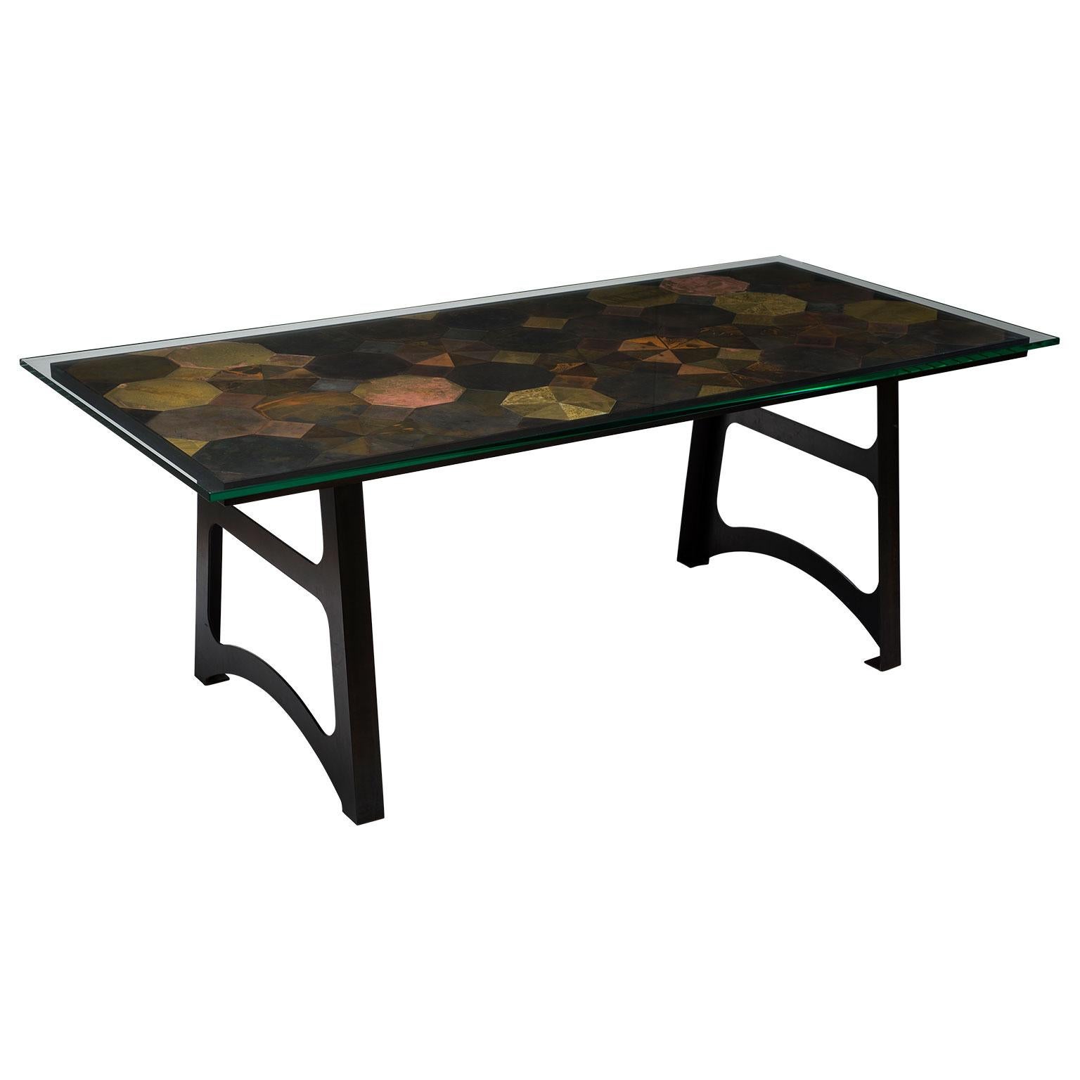 This unique Mosaic dining table with brass and steel tiles pays homage to a traditional Italian floor.

Made up of 141 individually patinated mild-steel and brass tiles, this unique table top blends a fusion of industrial colors and textures. This