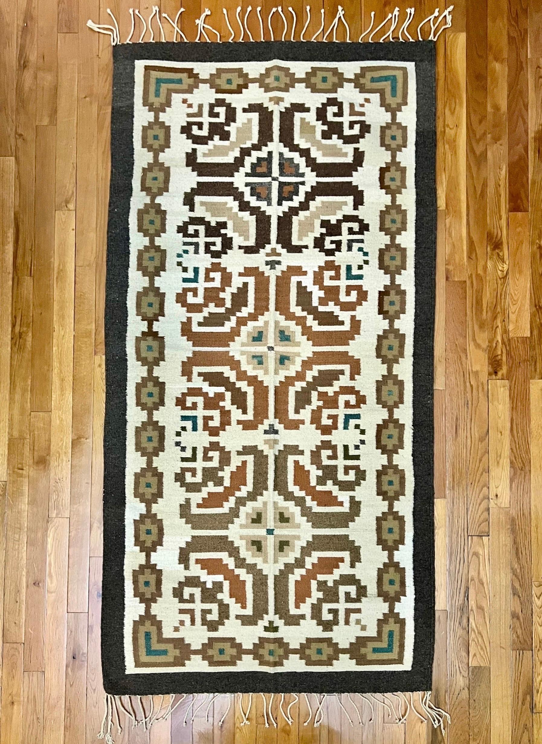 Stunning handcrafted Navajo rug 6' 7 x 2' 11, mid 20th century.  Navajo rugs are prized by collectors and some of the most beautiful pieces of art in this country.  The bold geometric pattern here is in varying tones of earthy brown with hints of