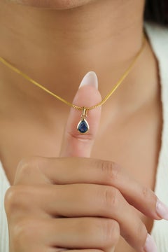 Handcrafted Natural Pear-Cut Blue Sapphire Solitaire Pendant in 14K Yellow Gold